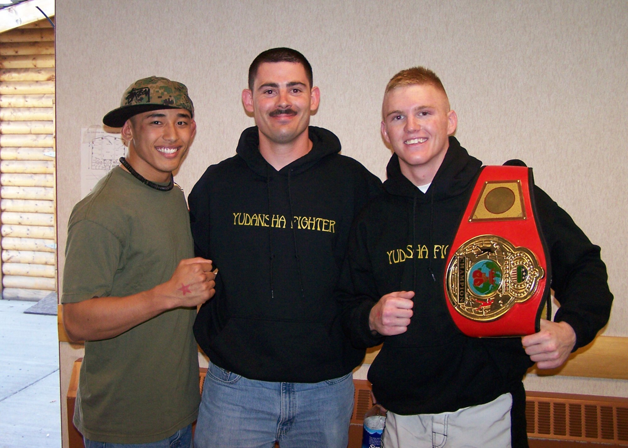 EIELSON AIR FORCE BASE, Alaska--Rico Respicio, Joseph Spedale and Brett Laswell pose for a shot after the June 22 Rumble on the River martial arts championship in Fairbanks. All are members of the Yudansha fighting system on base, Brett Laswell fought his way to a first place victory in the bantam weight class in two minutes and 45 seconds. Rico Respicio defeated his opponent in only 45 seconds. (courtesy photo)