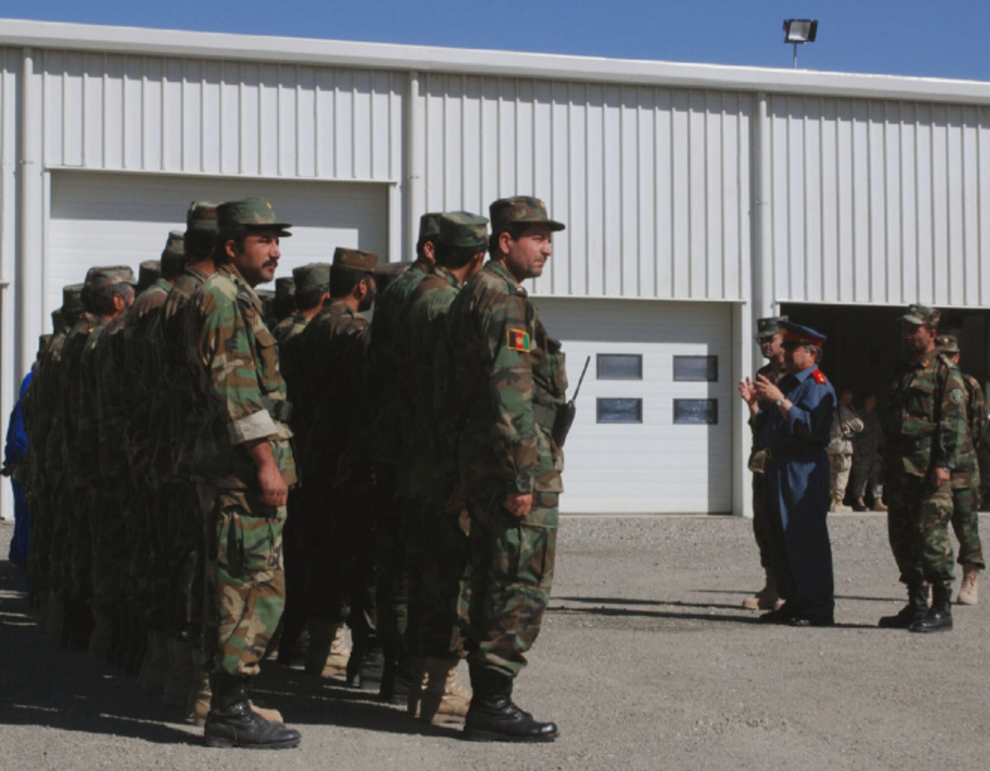 EIELSON AIR FORCE BASE, Alaska--Brig. Gen. Wahab, Kabul Air Base Wing commander, addresses Afghanistan National Army soldiers outside the new maintenance facility. (U.S. Air Force photo by Petty Officer First Class David Votroubek)