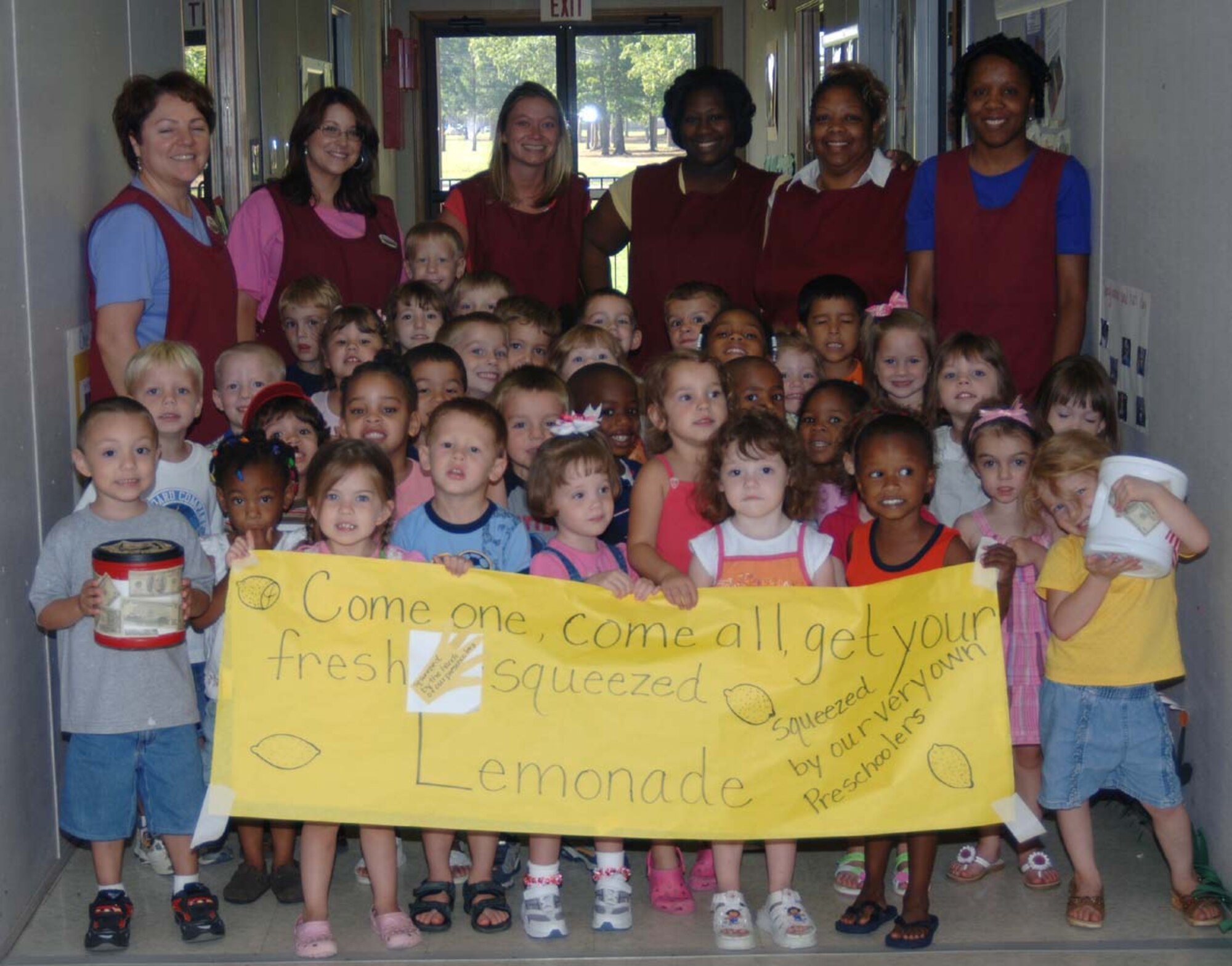 The children in Preschool classes 1, 2 and 3 made lemonade to raise money to send phone cards to deployed troops to be able to call home. (U.S. Air Force photo by Airman 1st Class Danielle Powell)