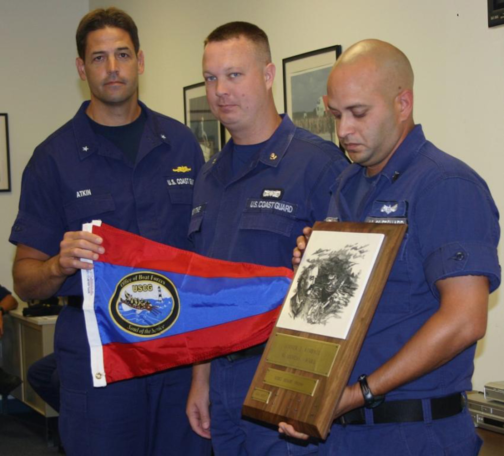 Rear Admiral Thomas Atkin (left) presented the prestigious Sumner I. Kimball Readiness Award to MSST Miami during his visit June 13. The Kimball Award requires a combination of good test scores, crew proficiency, great condition of vessels, excellent performance of underway drills, successful and progressive unit training programs, survival systems readiness and good administrative work by all members. A mere ten-percent of all Coast Guard small boat stations can earn the Kimball Award each year. (U.S. Coast Guard photo/LTJG Kaleb Perez)