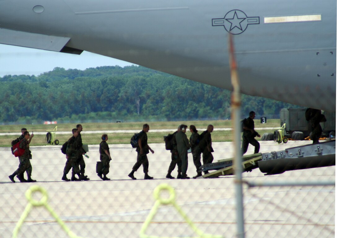 WRIGHT-PATTERSON AFB, Ohio -- Air Force reservists from the 87th Aerial Port Squadron board a C-17 aircraft June 30 bound for Hickam AFB, Hawaii.  Reservists will take-over the aerial port duties for two-weeks for their annual tour.  (U.S. Air Force photo/Maj. Ted Theopolos)