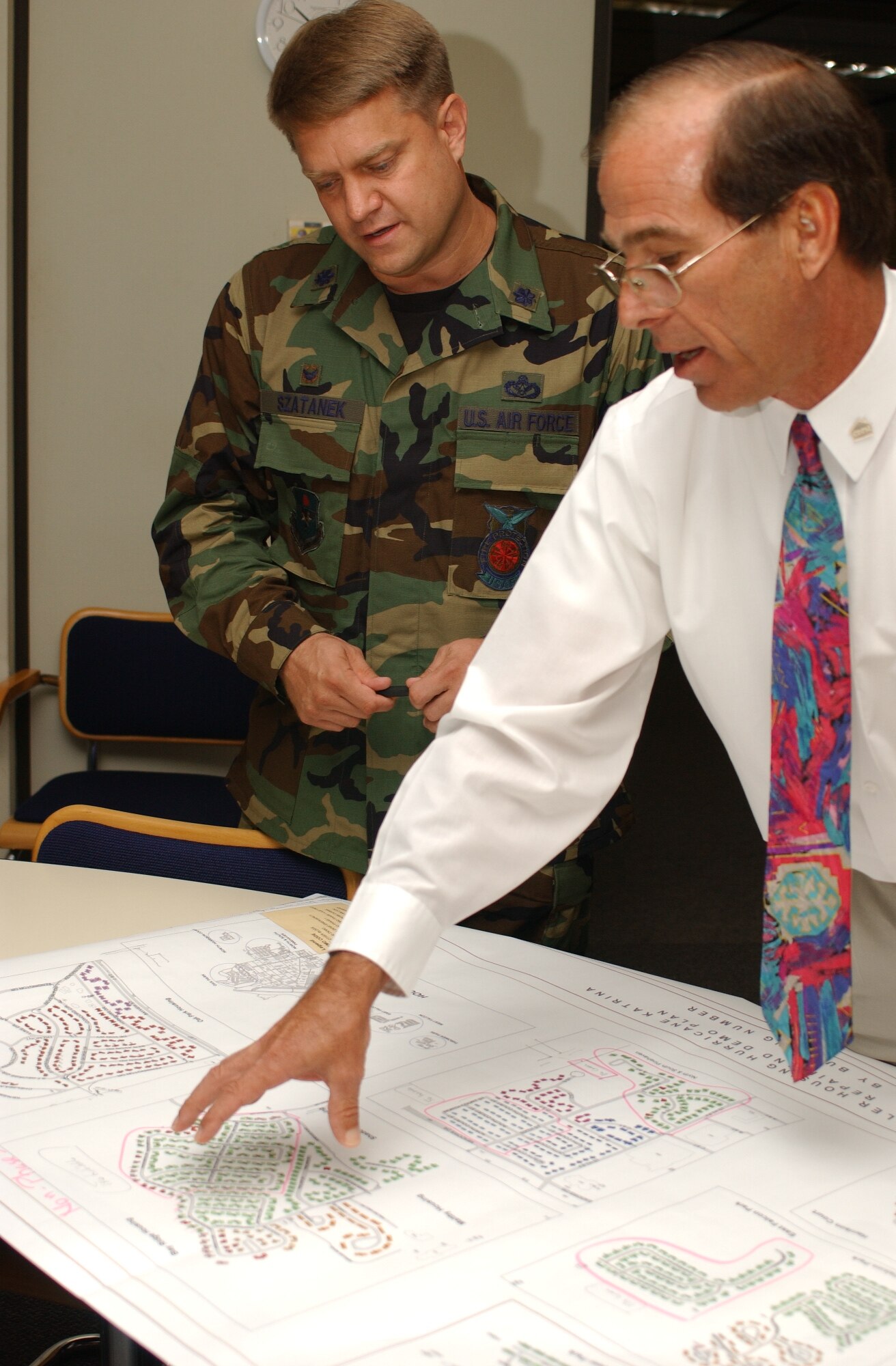 Lt. Col. Jeff Szatanek, left, new commander of the 81st Civil Engineer Squadon and Michael Reese, 81st CES housing flight chief, discuss plans for Keesler’s $287 million housing project.  Colonel Szatanek took command June 22.  (U. S. Air Force photo by Kemberly Groue)