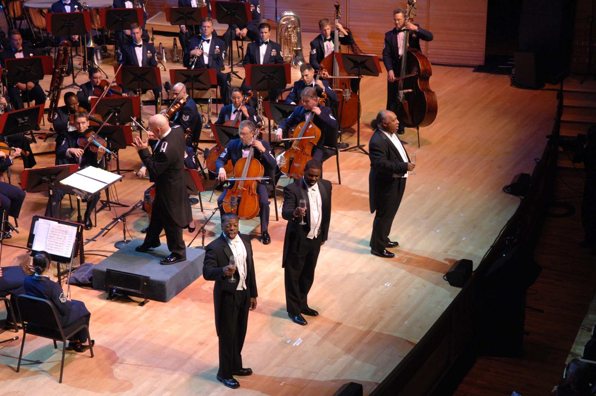 The Tenors Cook, Dixon and Young perform with the U.S. Air Force Band at Strathmore Music center in Bethesda, Md., June 30. The singing ensemble, consisting of Trent Cook, Rodrick Dixon and Thomas Young are a nationally know group that performed with the Band as part of a musical celebration of the U.S. Air Force's 60th anniversary. (U.S. Air Force photo by Airman 1st Class Timothy Chacon)