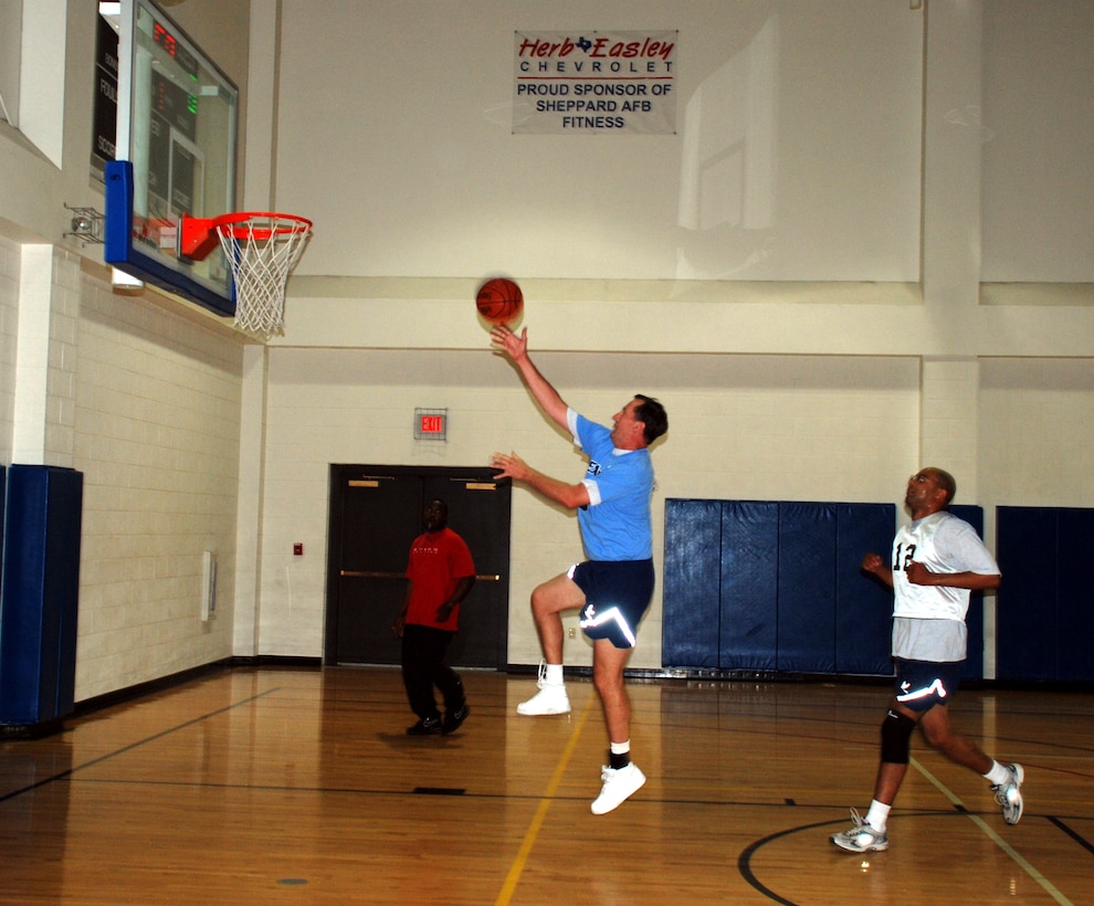 Col. Richard Munsell, 82nd Training Wing chaplain and Eagles team member, makes a jump shot during the vice commanders going away basketball tournament June 29 at the Pitsenbarger Fitness Center. Col. Lansen Conley's, 82nd TRW vice commander, team the Eagles, faced off against a team of Sheppard squadron commanders and a team of Sheppard senior NCO's. Coming out strong in the first game, the Eagles beat the squadron commander's team 24-23, but fell to the senior NCO's, 37-26. The Eagles never left the court between games. (U.S. Air Force photo/Airman 1st Class Jacob Corbin)