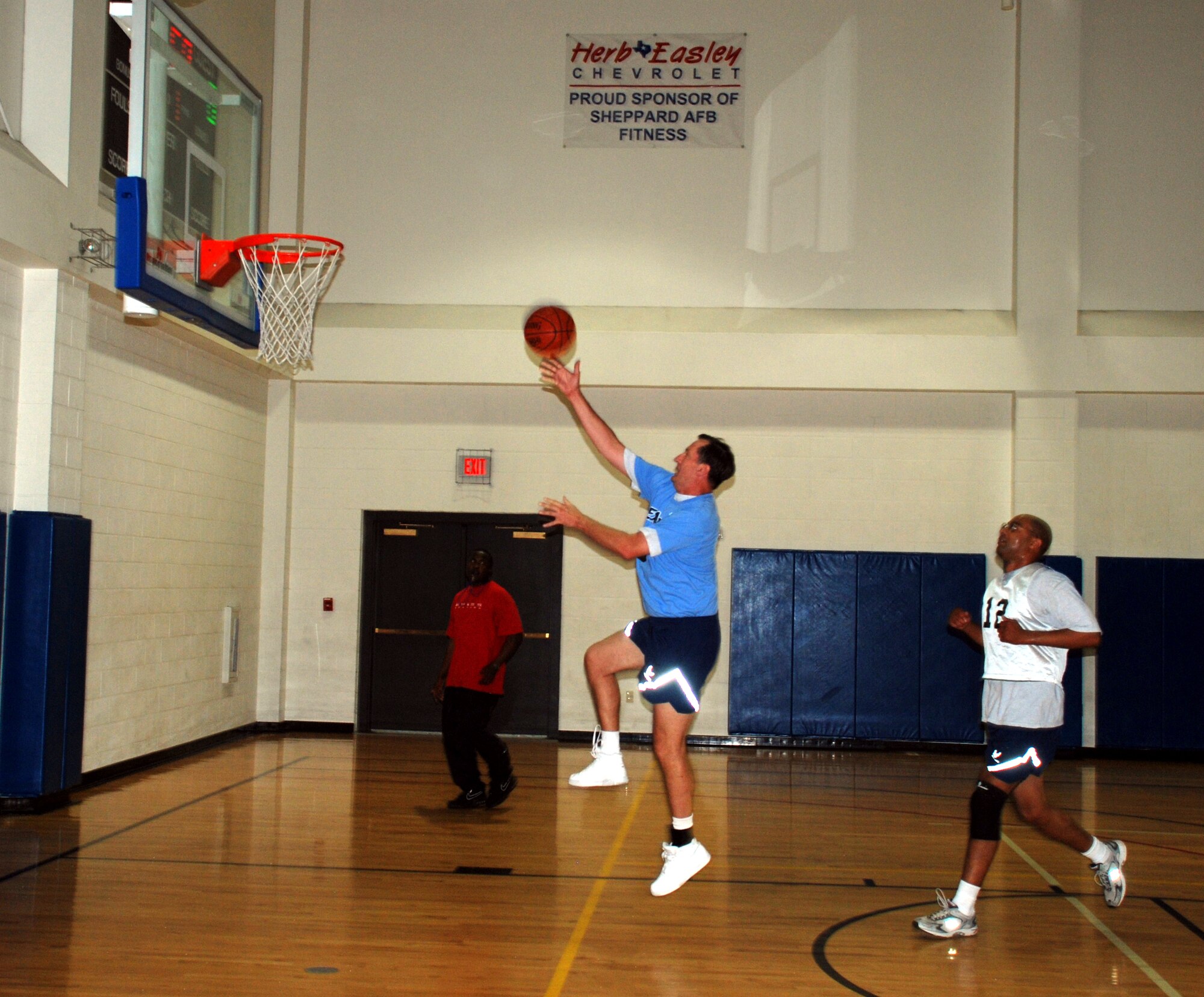 Col. Richard Munsell, 82nd Training Wing chaplain and Eagles team member, makes a jump shot during the vice commanders going away basketball tournament June 29 at the Pitsenbarger Fitness Center. Col. Lansen Conley's, 82nd TRW vice commander, team the Eagles, faced off against a team of Sheppard squadron commanders and a team of Sheppard senior NCO's. Coming out strong in the first game, the Eagles beat the squadron commander's team 24-23, but fell to the senior NCO's, 37-26. The Eagles never left the court between games. (U.S. Air Force photo/Airman 1st Class Jacob Corbin)