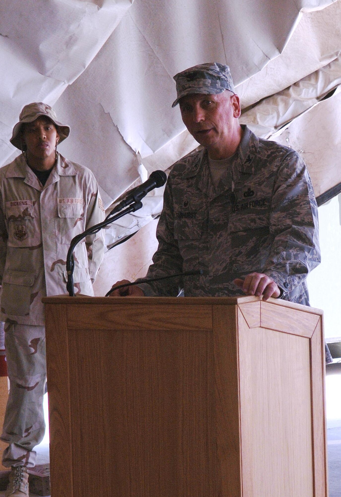 Col. Fred Fairhurst, 455th Air Expeditionary Group commander, speaks to the audience at a change of command ceremony after receiving command of the group at Bagram Airfield, Afghanistan. (U.S. Air Force photo by Staff Sgt. Craig Seals)