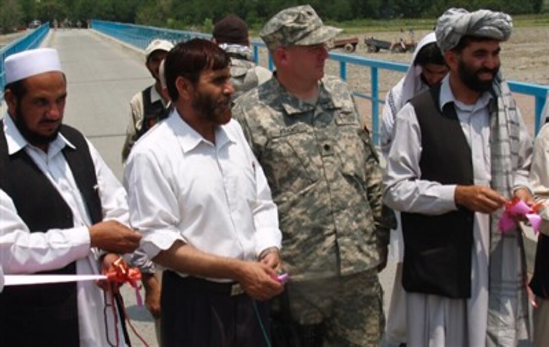 Provincial Reconstruction Team Khost Commanding Officer Navy Cmdr. David Adams, and Khost province Deputy Governor Ajab Khan Sangin re-opened the Shamal bridge, near  Gorbuz, Afghanistan, after major structural repairs and the complete replacement of several spans. The repairs were badly needed after last fall’s flooding caused the 15-year-old bridge to collapse.
