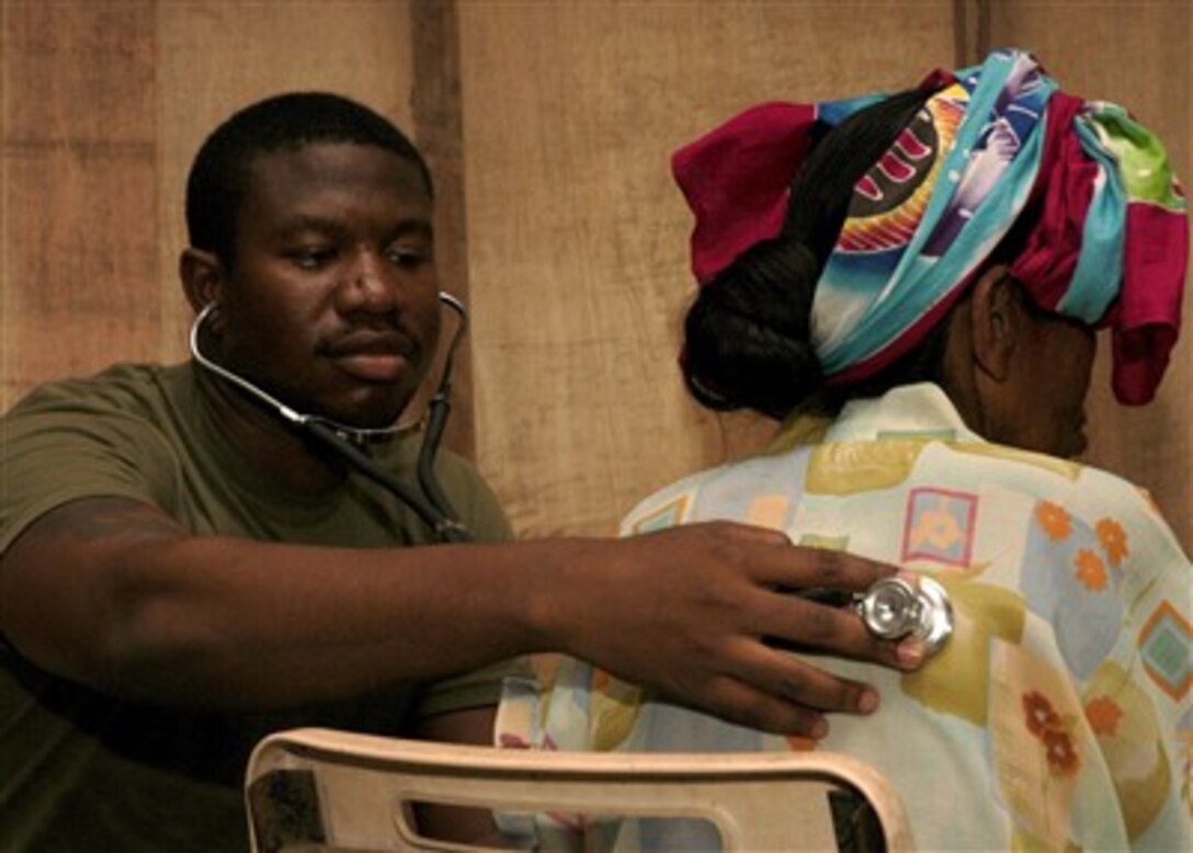 U.S. Navy Petty Officer 2nd Class Brandon Jackson uses a stethoscope to listen to a Filipino woman's heart and breathing during a medical civil assistance program at the Suh Elementary School in Jolo, Philippines, on July 1, 2007.  Jackson is a hospital corpsman attached to Fleet Surgical Team 1 that is embarked aboard the USS Peleliu (LHA 5) in support of Exercise Pacific Partnership.  