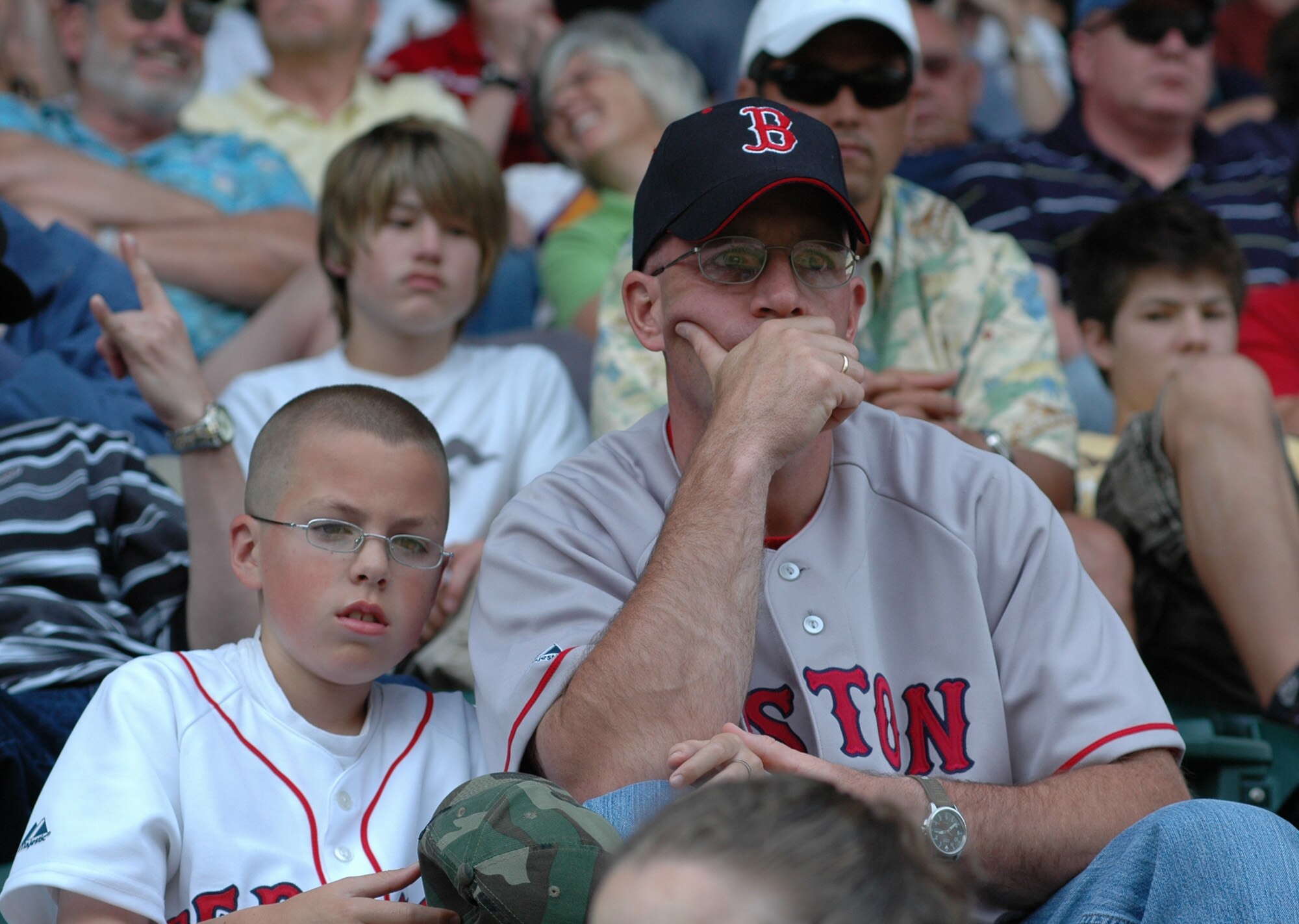 FAIRCHILD AIR FORCE BASE, Wash. -- Tech. Sgt. Robert Downs, 92nd Logistics Readiness Squadron vehicle maintenance NCOIC customer service, sits in the bleachers with his son Robert II during a baseball game in Seattle June 27. The trip provided ample bonding time for family members and co-workers throughout the 92nd LRS. (U.S. Air Force photo/Tech. Sgt. Larry W. Carpenter Jr.)