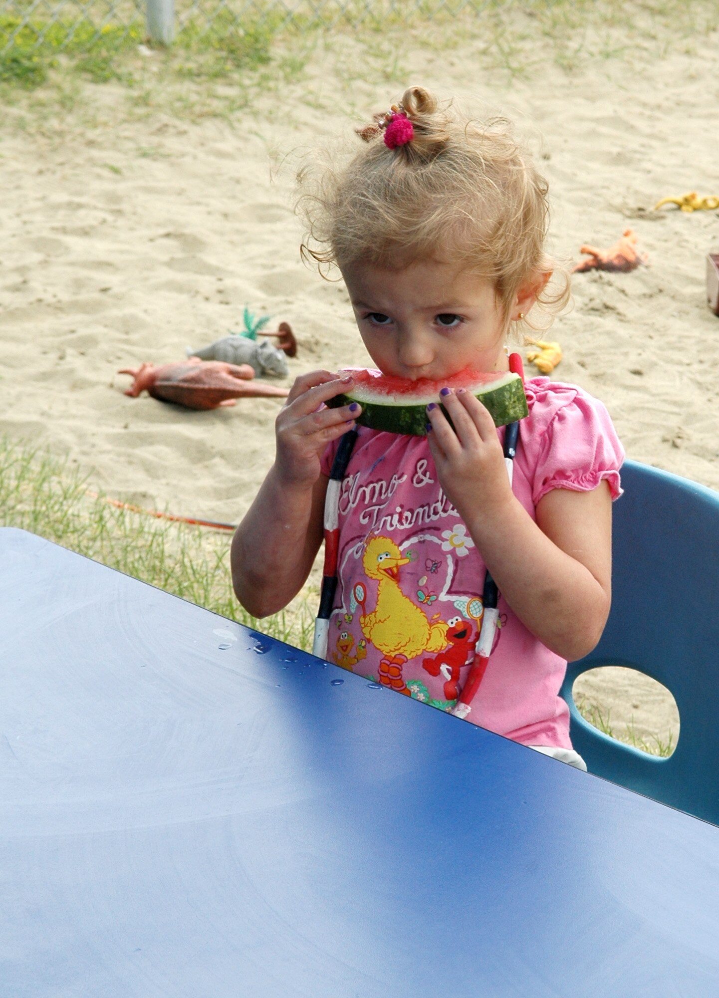 FAIRCHILD AIR FORCE BASE, Wash. -- Karissa Broderson, 2, chomps down on a bite of watermelon during the Child Development Center’s Watermelon Day, an event geared towards providing entertainment and quality time for children and their parents. Karissa is the daughter of Erik Broderson, 92nd Medical Support Squadron pharmacy technician, and his wife, Julia. (U.S. Air Force photo/Airman 1st Class Kali L. Gradishar)