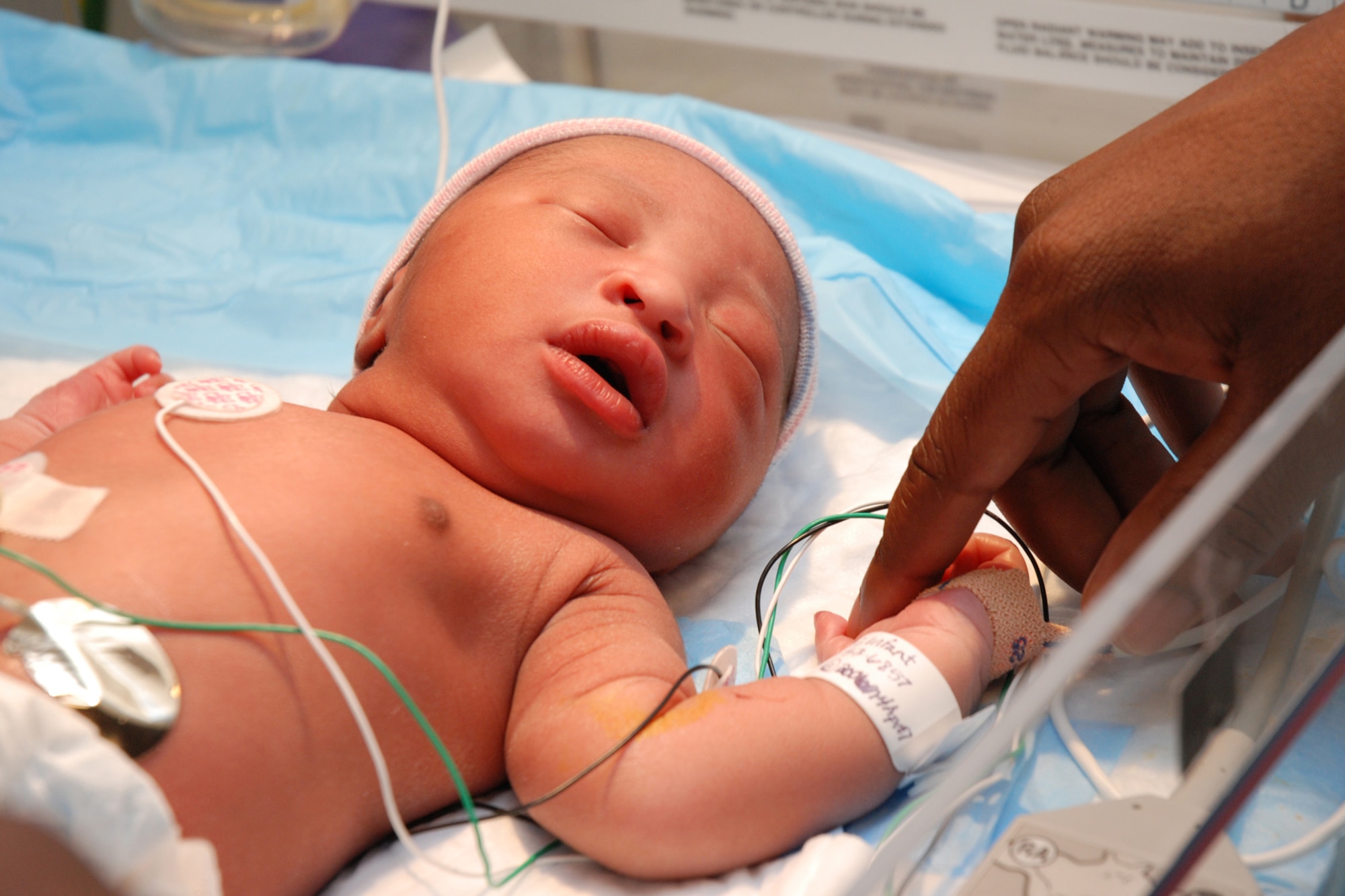 EGLIN AIR FORCE BASE, Fla. -- Christopher Deveaux Badger, only hours old April 4, received immediate care for an accelerated heart beat after his birth in the labor and delivery unit at Eglin Hospital. The 96th Inpatient Operations Squadron at the Eglin Hospital activated when Lt. Col. Corrine Naughton assumed command during a ceremony at the Air Armament Museum here June 29. Flights form other medical squadrons were reorganized under the new unit as past of the Air Force Surgeon General Flight Plan. The 96th IPTS has three flights that operate within the squadron: the Maternal Child flight, the Multiservice Flight and the Critical Care Flight. (U.S. Air Force Photo by Staff Sgt. Mike Meares)