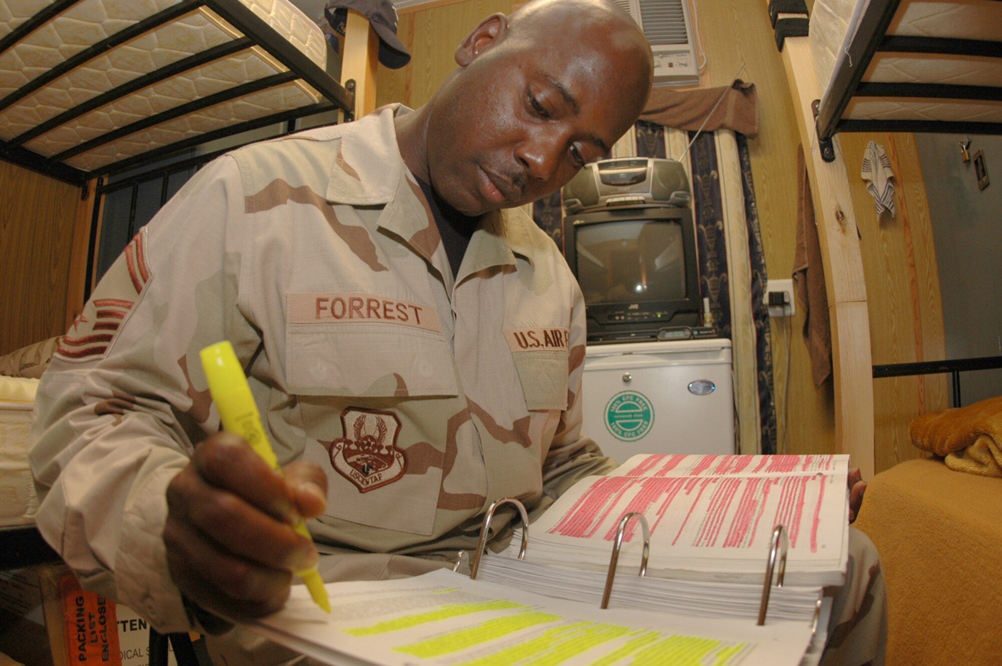 Senior Master Sgt. Robert Forrest, Combined Air Operations Center superintendent of theater medical logistics, takes advantage of his free time here to study for his promotion exam. Sergeant Forrest is deployed from Langley, where he is the 1st Medical Support Squadron superintendent. (U.S. Air Force photo/Senior Airman Clark Staehle)