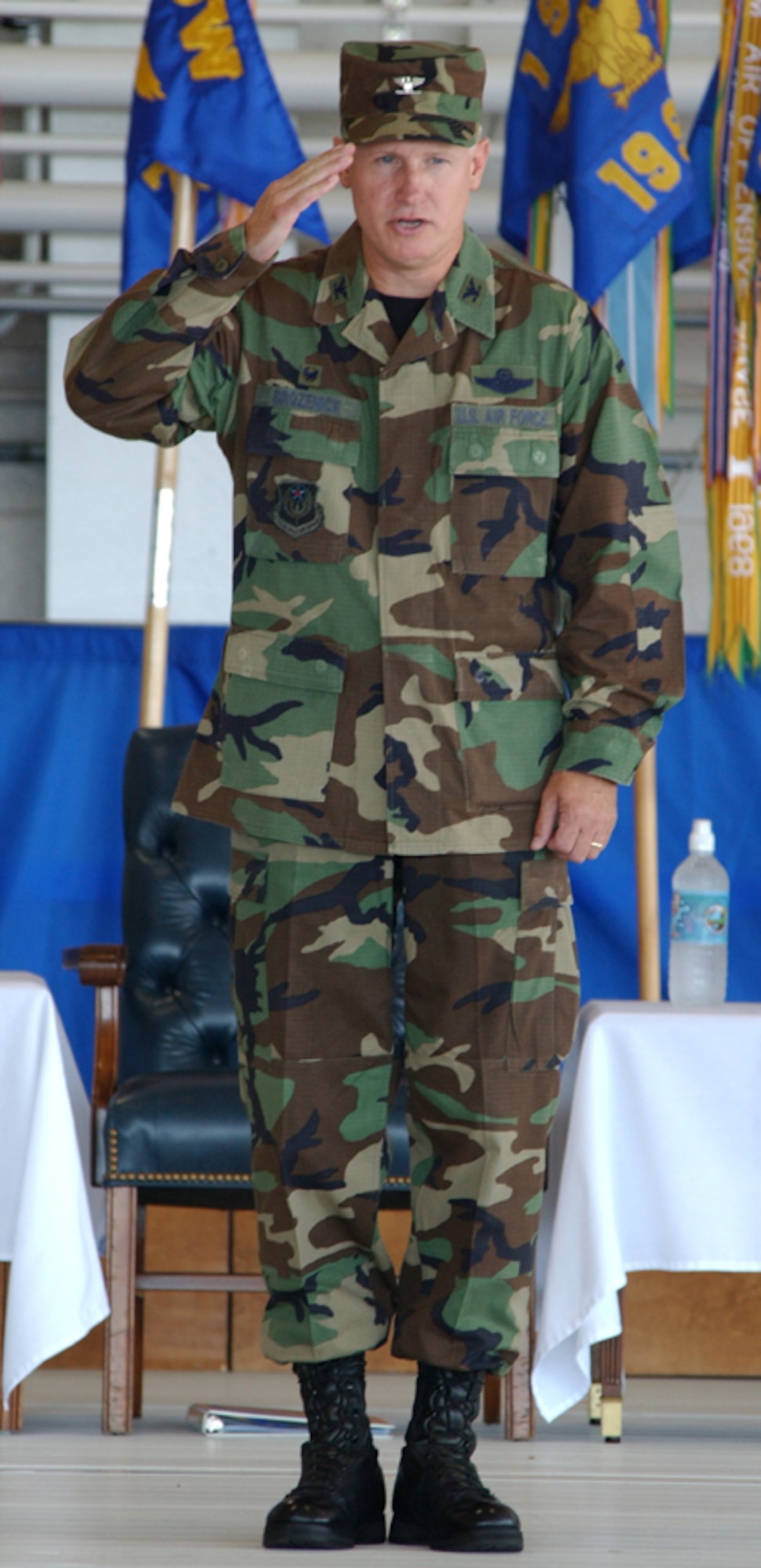 Col. Norm Brozenick Jr., former 1st Special Operations Wing commander, renders his final salute to the men and women of the 1st SOW during the change of command ceremony held Tuesday at Freedom Hangar. (U.S. Air Force photo by Tech. Sgt. Angela Shepherd)