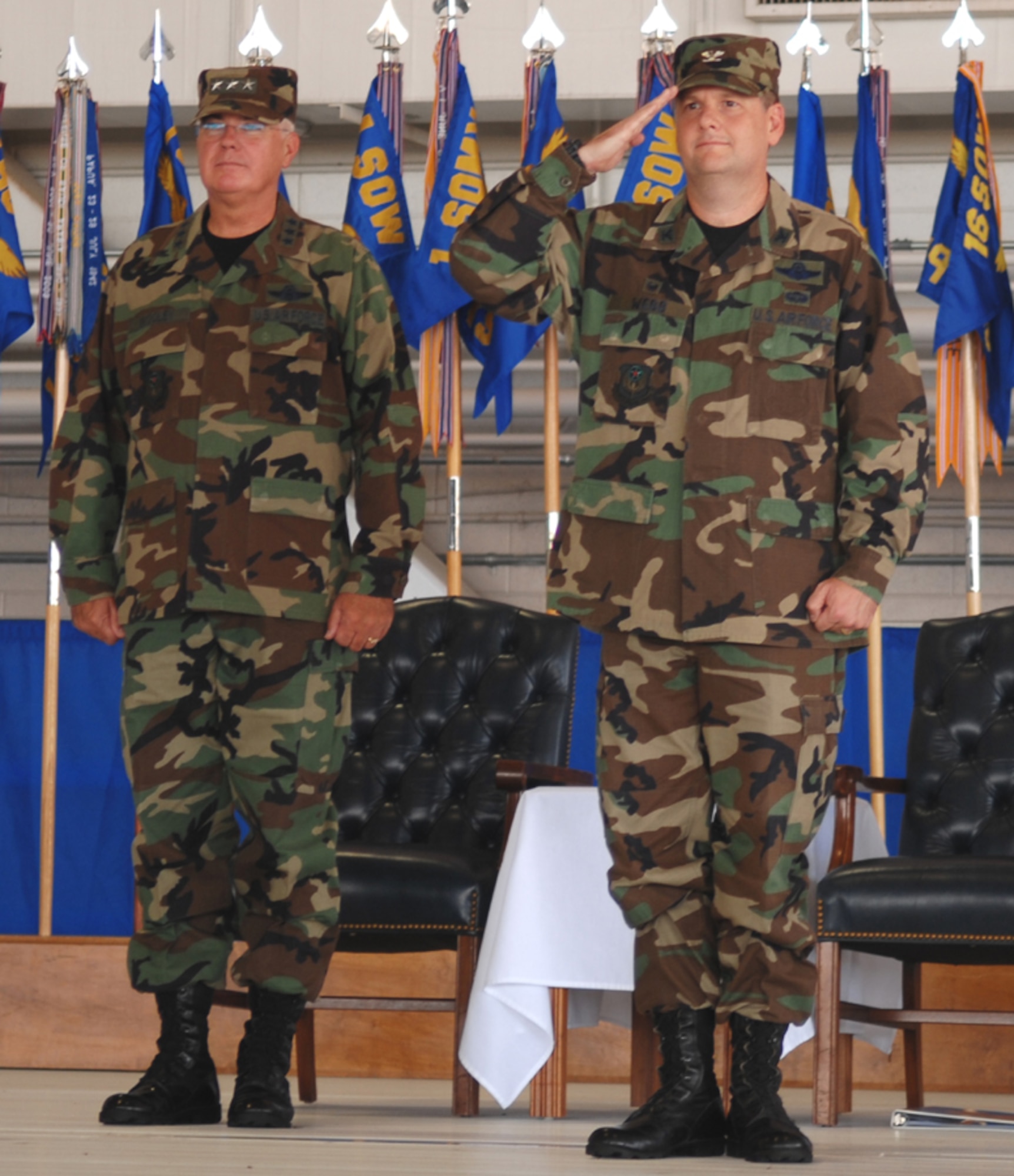 Col. Brad Webb, the new 1st Special Operations Wing commander, renders his first salute to the men and women of the 1st SOW during the change of command ceremony held Tuesday at Freedom Hangar. (U.S. Air Force photo by Senior Airman Andy Kin)