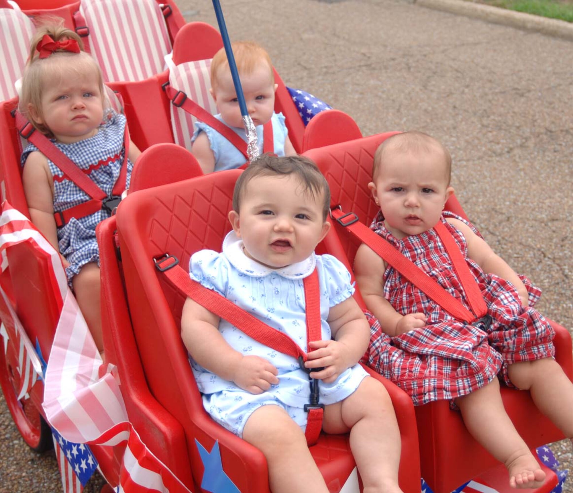 Youth at the Child Development Center take part in a parade Tuesday to celebrate Independence Day. Youth made noise makers and carried flags through the parade. Many parents were onsite to watch the children march. (U.S. Air Force Photo by Airman 1st Class Danielle Powell)