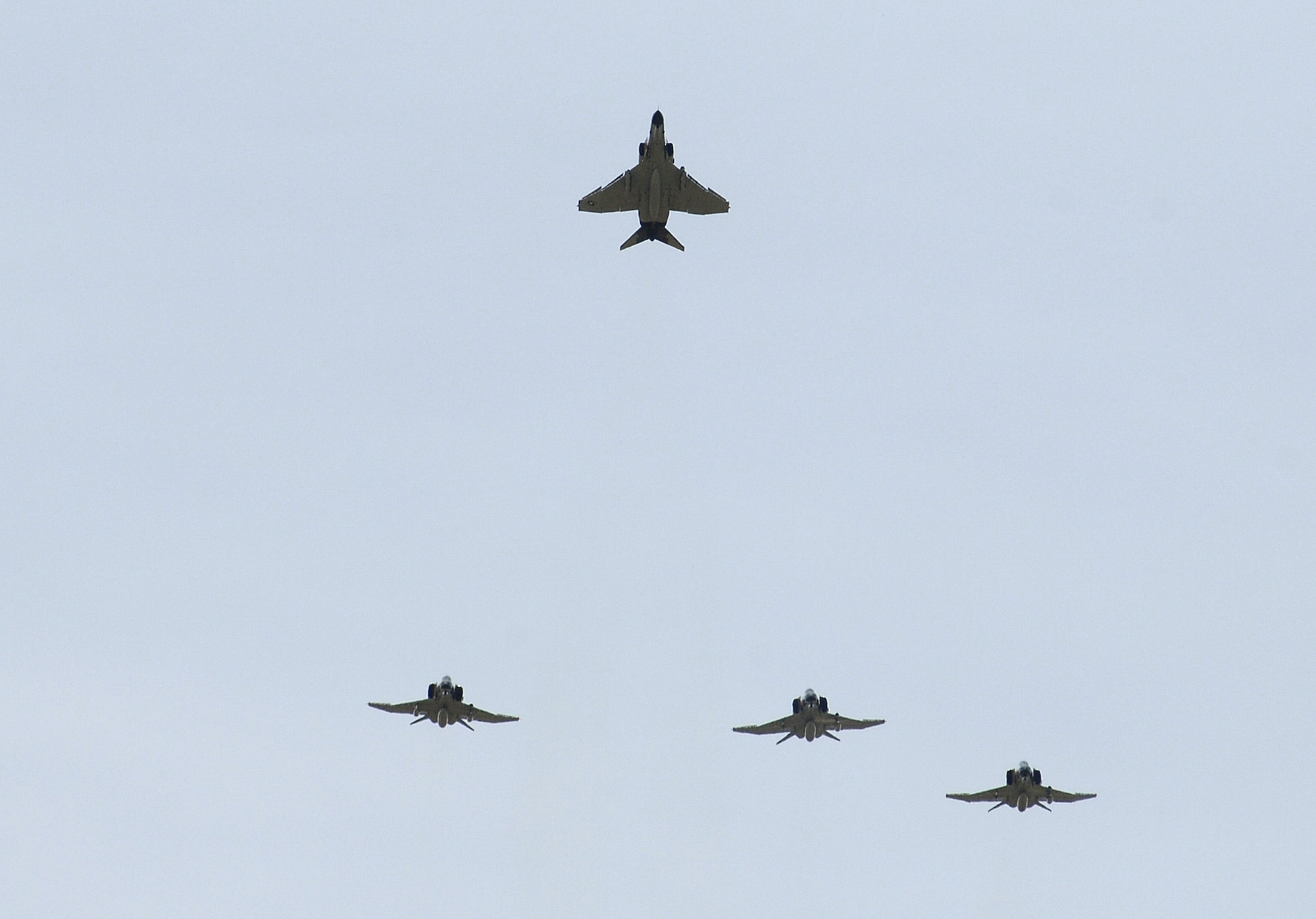 U.S. Air Force Academy, CO --  F-4 Phantoms execute a Missing Man formation over the funeral of Brig Gen Robin Olds, who passed away June 14, 2007 at the age of 84.  Gen Olds was buried at the Air Force Academy, where he served as commandant of cadets from 1967 to 1971.  The F-4s were flown by Lt. Col. Anthony Murphy and Maj. Chris Vance, 82nd Aerial Targets Squadron from Tyndall, and Lt. Col. JD Lee and Maj. John Markle from Detachment 1, 82nd Aerial Targets Squadron at Holloman. They're painted in the Vietnam era camouflage. (Air Force Photo/Dennis Rogers)

