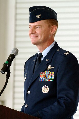 Col. John "Red" Millander, 437th Airlift Wing commander, speaks at the 437th Airlift Wing change of command ceremony in Charleston AFB's Nose Dock 2, June 25. (U.S. Air Force photo/Staff Sgt. Marie Cassetty)