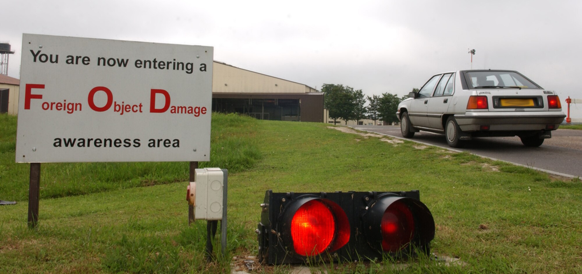 While the new policy for foreign object damage  check procedures has been in effect since May 23, 2007, the updated signs reflecting the changes have not been posted yet. The signs, which will be posted in 34 locations on RAF Mildenhall will read: "FOD CHECK POINT, Vehicle/Equipment Tires must be checked if they have been operated on an unpaved surface". Also, vehicle operators must always remember to stop and give way to other vehicles or aircraft on the taxiway or flight line area. (U.S. Air Force photo by: Tech. Sgt. Tracy L. DeMarco)