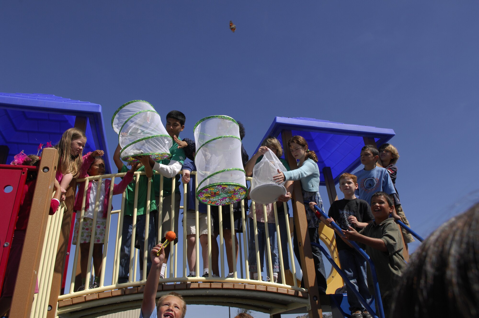 VANDENBERG AIR FORCE BASE, Calif. -- Vandenberg Youth Center students and faculty release painted lady butterflies June 29 after being grown from a crystalisis stage as part of a summer science project. (U.S. Air Force photo/Staff Sgt. Samuel Bendet)