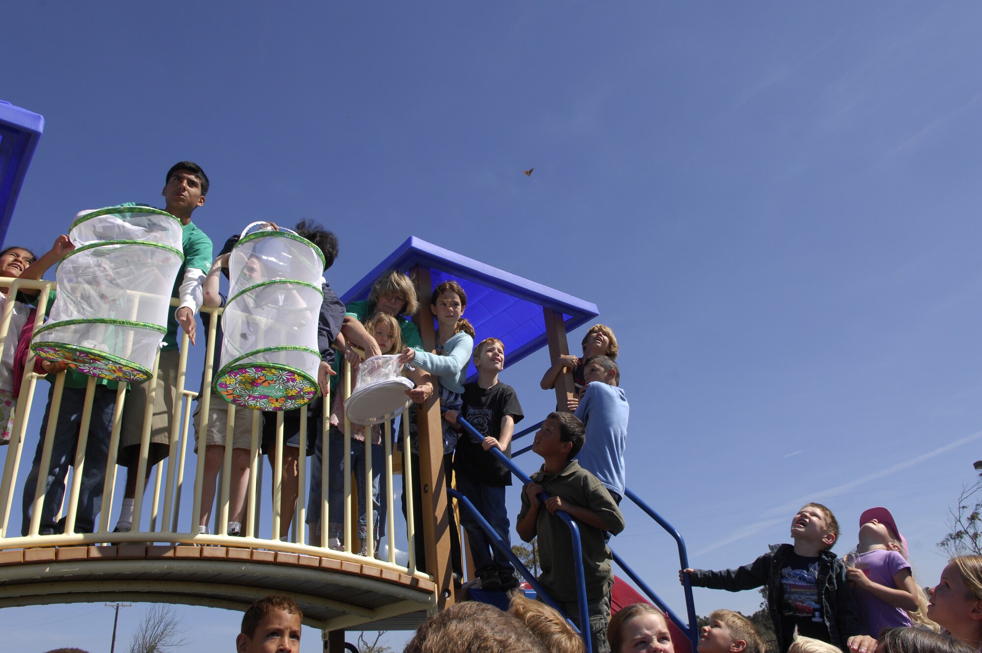 VANDENBERG AIR FORCE BASE, Calif. -- Vandenberg Youth Center students and faculty release painted lady butterflies June 29 after being grown from a crystalisis stage as part of a summer science project. (U.S. Air Force photo/Staff Sgt. Samuel Bendet)