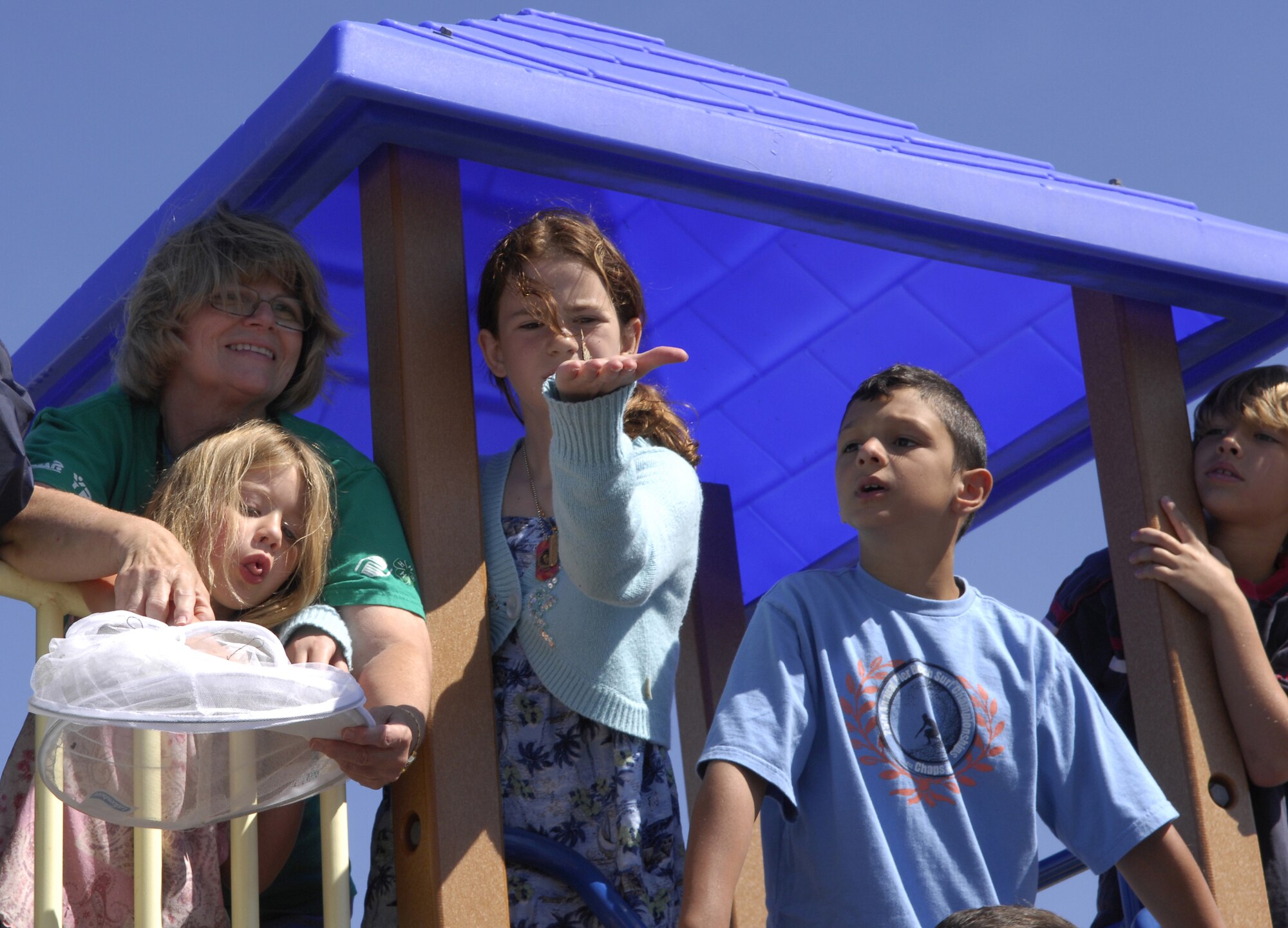 VANDENBERG AIR FORCE BASE, Calif. -- Vandenberg Youth Center students and faculty release painted lady butterflies June 29 after being grown from a crystalisis stage as part of a summer science project. (U.S. Air Force photo/Staff Sgt. Samuel Bendet)