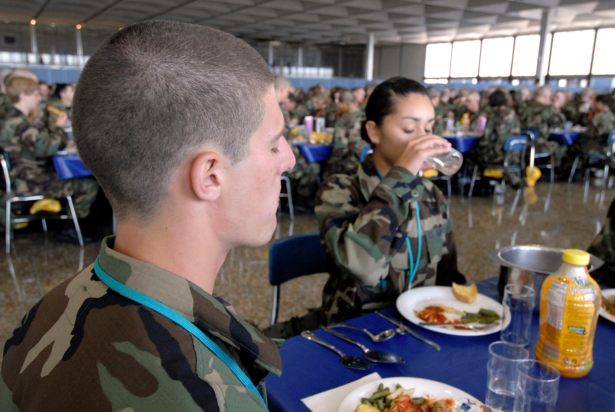 Basic cadet trainees must follow strict rules as they eat their first lunch since arriving as the Class of 2011 June 29 at the U.S. Air Force Academy in Colorado. The cadets are in their first week of training and must not take their eyes off the eagle on their plate as they eat. They are in the first half of basic cadet training, commonly known as "First Beast." (U.S. Air Force photo/Mike Kaplan)