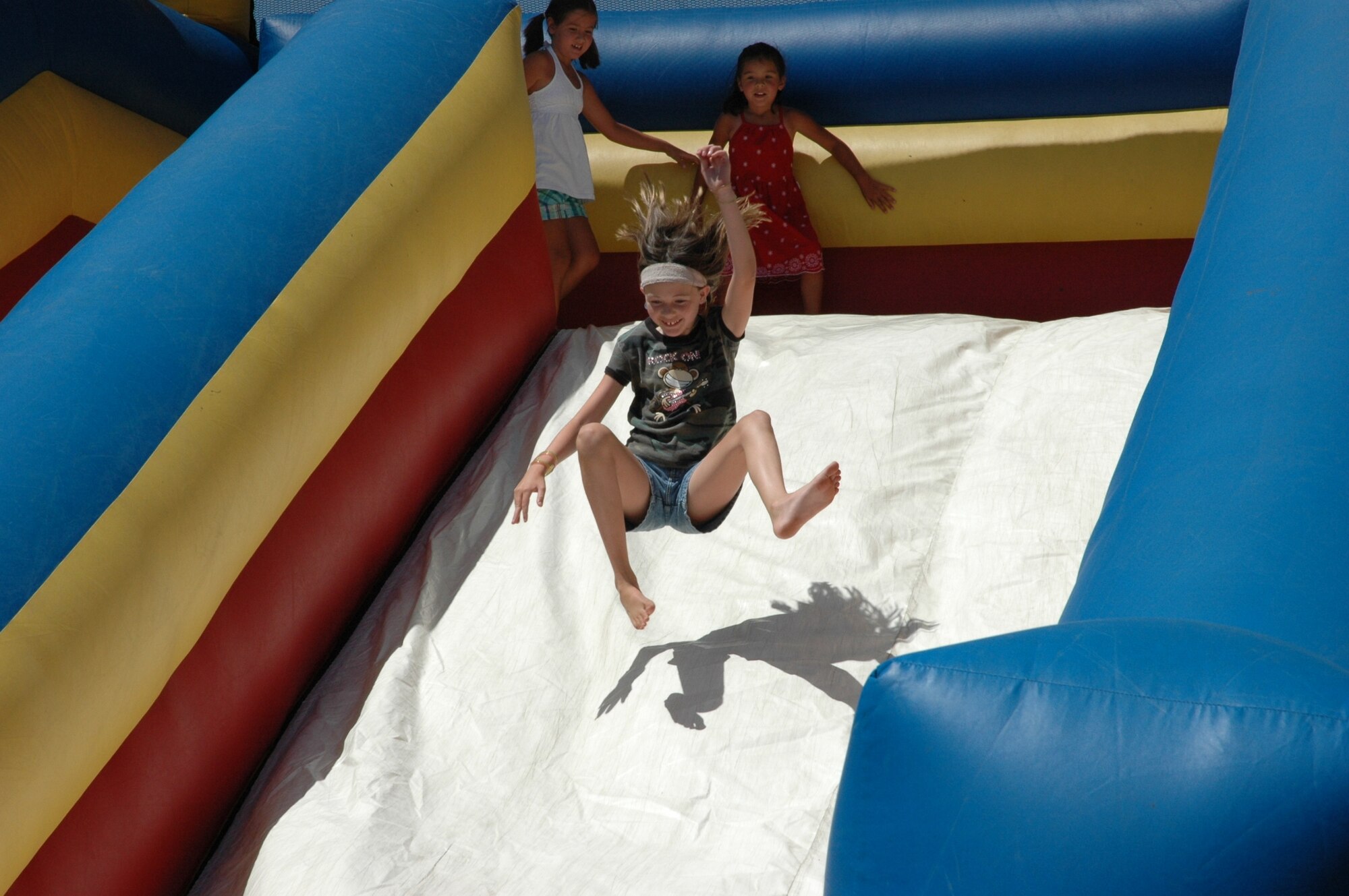 HILL AIR FORCE BASE, Utah -- Several different activities for families and their children were available at the picnic. A climbing wall, inflated slide, Velcro jump, boxing ring and bouncy room were all available for children to have fun. (U.S. Air Force photo by Senior Airman Brok McCarthy)
