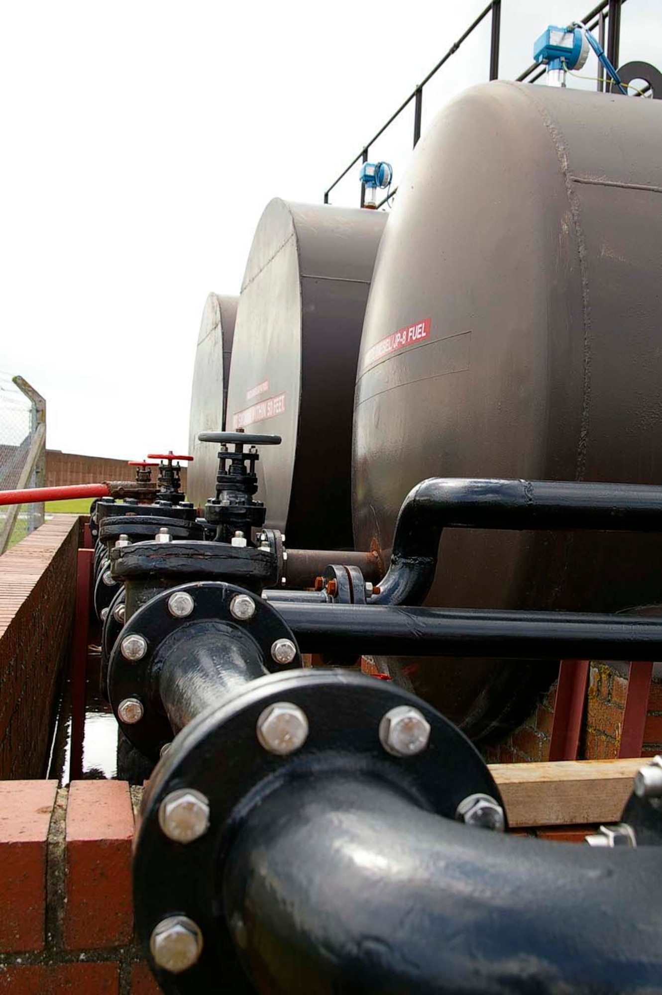 The distribution ring main runs from the filter system to the storage tanks. Paul Murfitt, 100th Civil Engineer Squadron, came up with the idea to recycle JP-8 so it can be used as heating fuel. With help from Paul Gee, Brian MacKender and James Tarver, all 100th CES civilian employees, he built the equipment using recycled parts. Lab results showed the recycled fuel was pretty close to raw JP-8. (U.S. Air Force photo by Karen Abeyasekere)