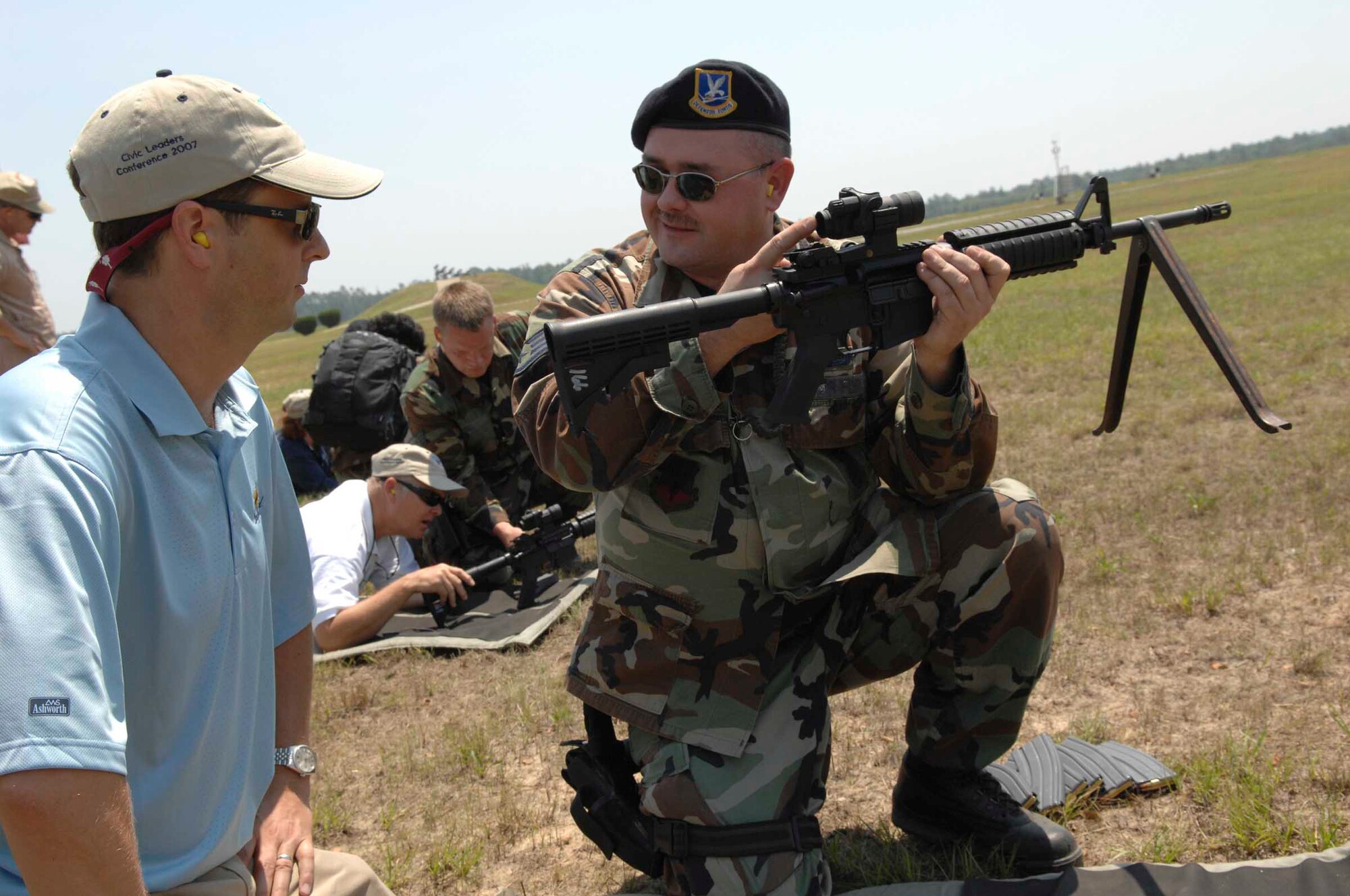 POINSETT RANGE, S.C. -- Staff Sgt. Richard Dorsey teaches civic leaders of the 9th Air Force Civic Leaders Tour how to operate an M-16 rifle June 22. The tour was an opportunity to show civic leaders throughout 9th AF some of the day-to-day experiences Airmen face while at home and deployed. (U.S. Air Force photo by Staff Sgt. Josef Cole)