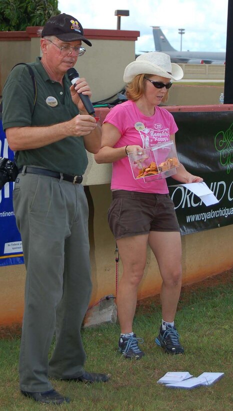 Ralph Ridgeway, 36th Services Squadron, calls out winning raffle ticket numbers for more than $10,000 in prizes Tuesday during Andersen's annual Freedom Fest at Arc Light Park. (U.S. Air Force Photo/Airman 1st Class Carissa Morgan)