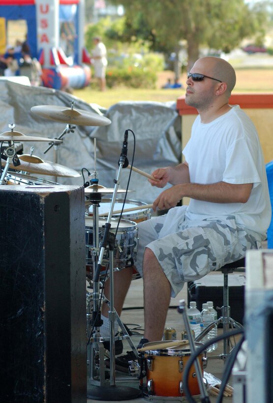 Sons of Bill drummer Todd Wellons entertains Team Andersen members during the base's annual Freedom Fest to celebrate Independence Day Tuesday at Arc Light Park. The band flew all the way from from Charlottesville, Va. (U.S. Air Force Photo/Airman 1st Class Carissa Morgan)