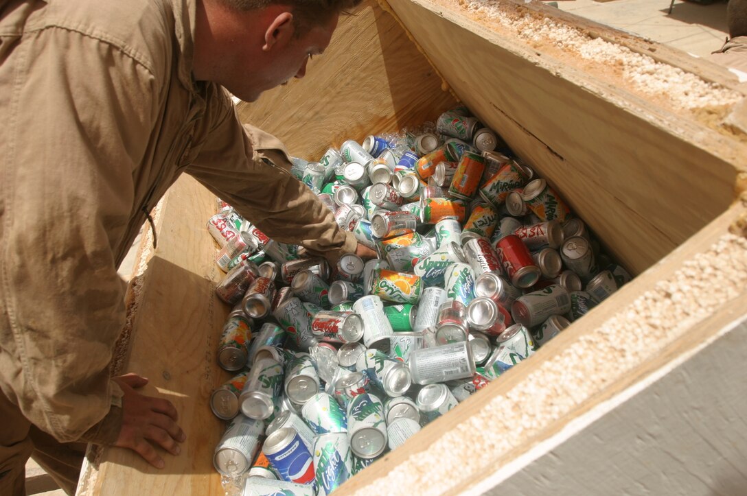A Marine from 3rd Battalion, 1st Marines reaches for a cold drink during a July 4 holiday barbecue at the Chuck Norris Cafe here.