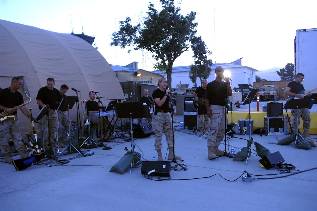 The CENTAF Band performs on the basketball court in Camp Cunningham to dozens of Airmen assigned to the 455th Air Expeditionary Wing July 3 at Bagram Airfield, Afghanistan. The band made its way through Bagram to perform in honor of Independence Day. (U.S. Air Force photo by Staff Sgt. Craig Seals)