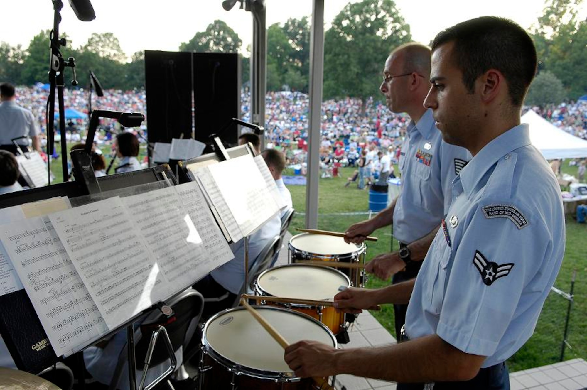Percussionist, Airman 1st Class Joe Hadacek and Tech Sgt. Paul Shaw, play the drums for the U.S. Air Force Band of Mid-America during a performance at the Jefferson Barrack Blast, July 3, 2007.  St. Louis County, in partnership with the Air Force during Air Force Week, put on the blast, entertaining the more than 20,000 in attendance. 
(U.S. Air Force photo/Staff Sgt. Brian Ferguson)
