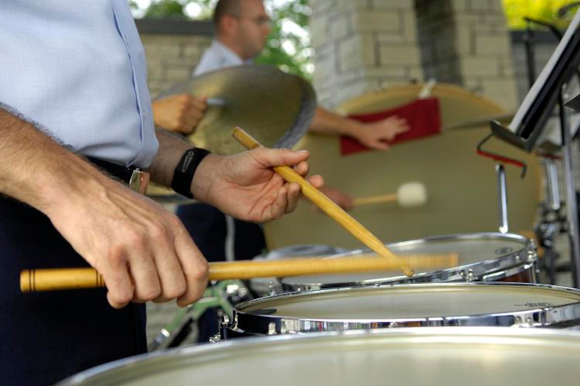 Percussionist, Tech Sgt. Paul Shaw, plays a drum as the U.S. Air Force Band of Mid-America plays for the crowd at the Jefferson Barrack Blast, July 3, 2007.  St. Louis County, in partnership with the Air Force during Air Force Week, put on the blast, entertaining the more than 20,000 in attendance. 
(U.S. Air Force photo/Staff Sgt. Brian Ferguson)
