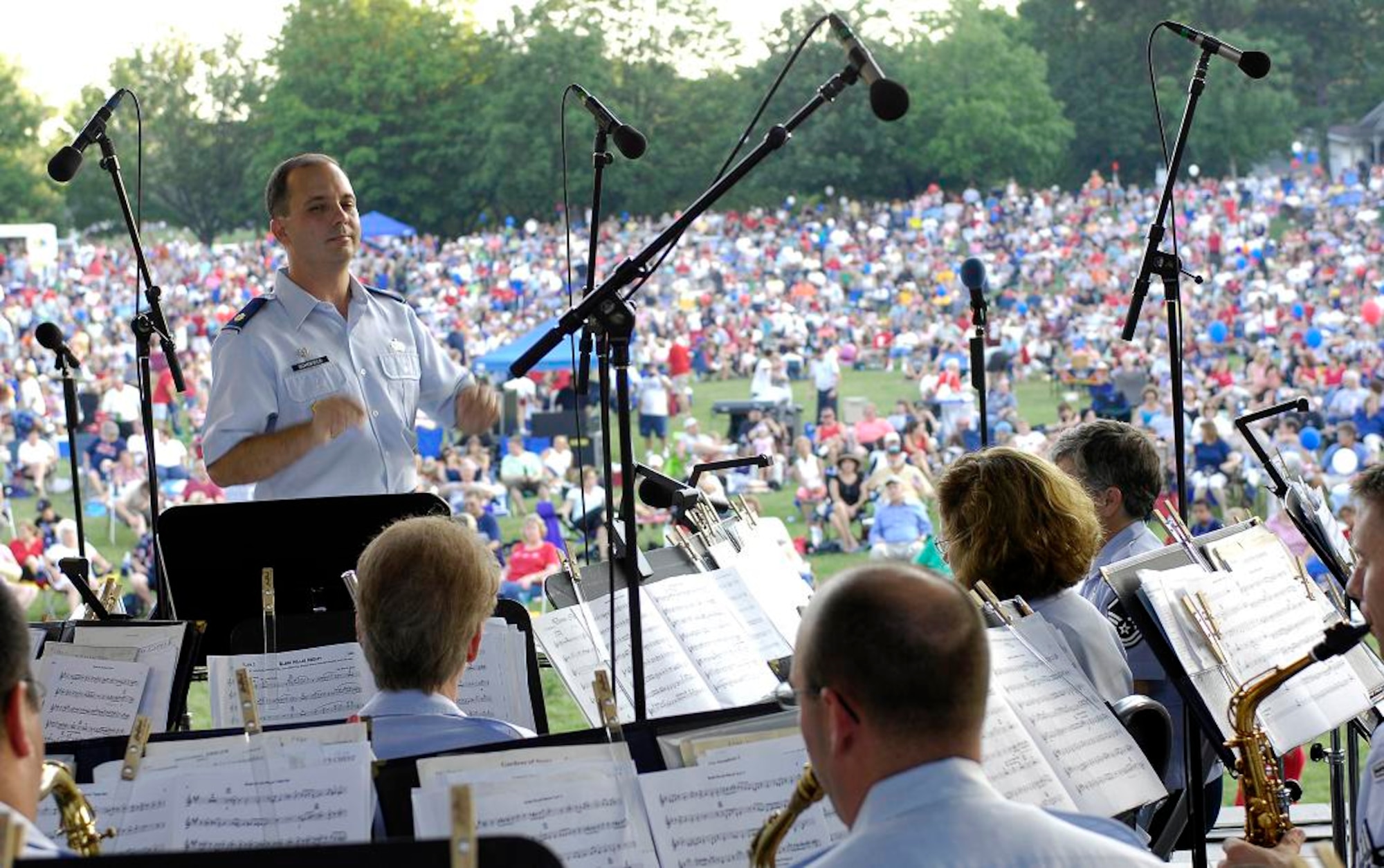 Commander and Conductor, Maj. Don Schofield, leads the U.S. Air Force Band of Mid-America as the perform at the Jefferson Barracks Blast, July 3, 2007.  St. Louis County, in partnership with the Air Force during Air Force Week, put on the blast, entertaining the more than 20,000 in attendance. 
(U.S. Air Force photo/Staff Sgt. Brian Ferguson)