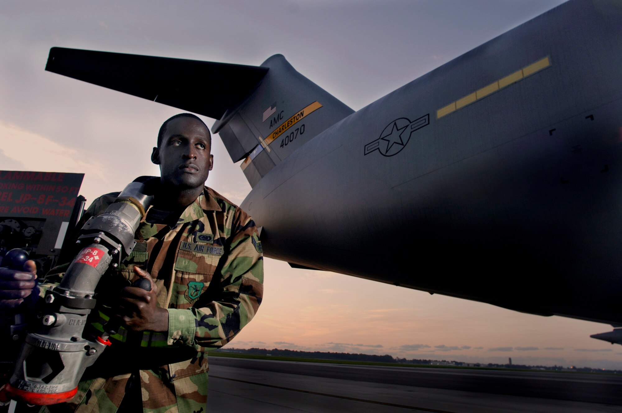 Airman 1st Class Michael Brown, 437th Logistics Readiness Squadron fuels journeyman, prepares to refuel a Charleston C-17 on the flightline Wednesday morning. Airman Brown became the third Team Charleston member to pump 1,000,000 gallons of fuel in one month.  (U.S. Air Force Photo/Airman 1st Class Nicholas Pilch)