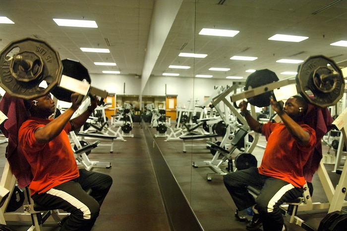 Chris Riley, 437th Maintenance Group, works his triceps and anterior deltoid muscles on the super incline press using the hammer strength machine. (U.S. Air Force Photo/Airman 1st Class Nicholas Pilch)