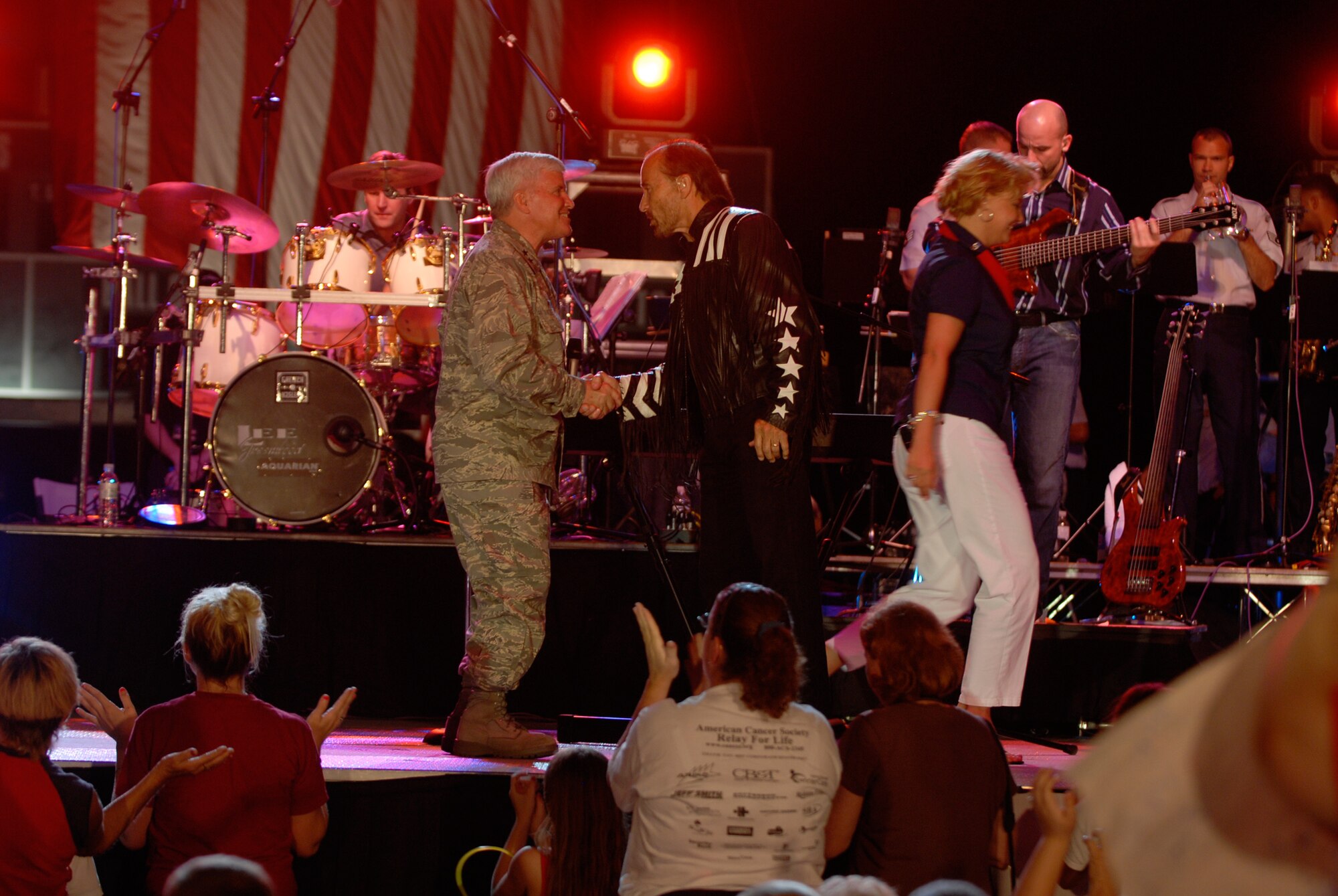 Maj. Gen. Allan Poulin, Air Force Reserve Command vice commander, greets recording artist Lee Greenwood at the Independence Day Concert in Warner Robins, Ga., July 3. The concert, which also features the Band of the Air Force Reserve, is being broadcast worldwide over the American Forces Network beginning July 4. (Courtesy photo/Ken Hackman)
