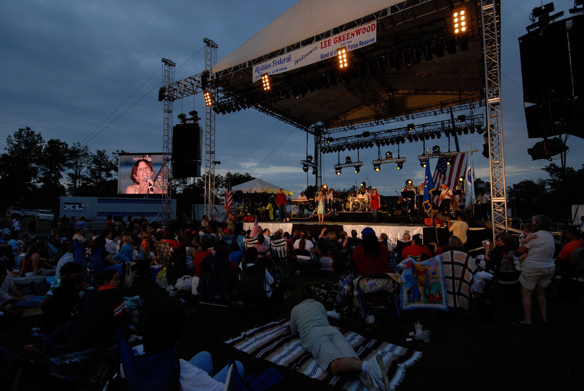 The Band of the Air Force Reserve performs during the annual Independence Day concert in Warner Robins, Ga., on July 3. Lee Greenwood headlines the concert that will air on the American Forces Network beginning July 4. The concert is sponsored by the Air Force Reserve Command. (Photo courtesy/Ken Hackman)