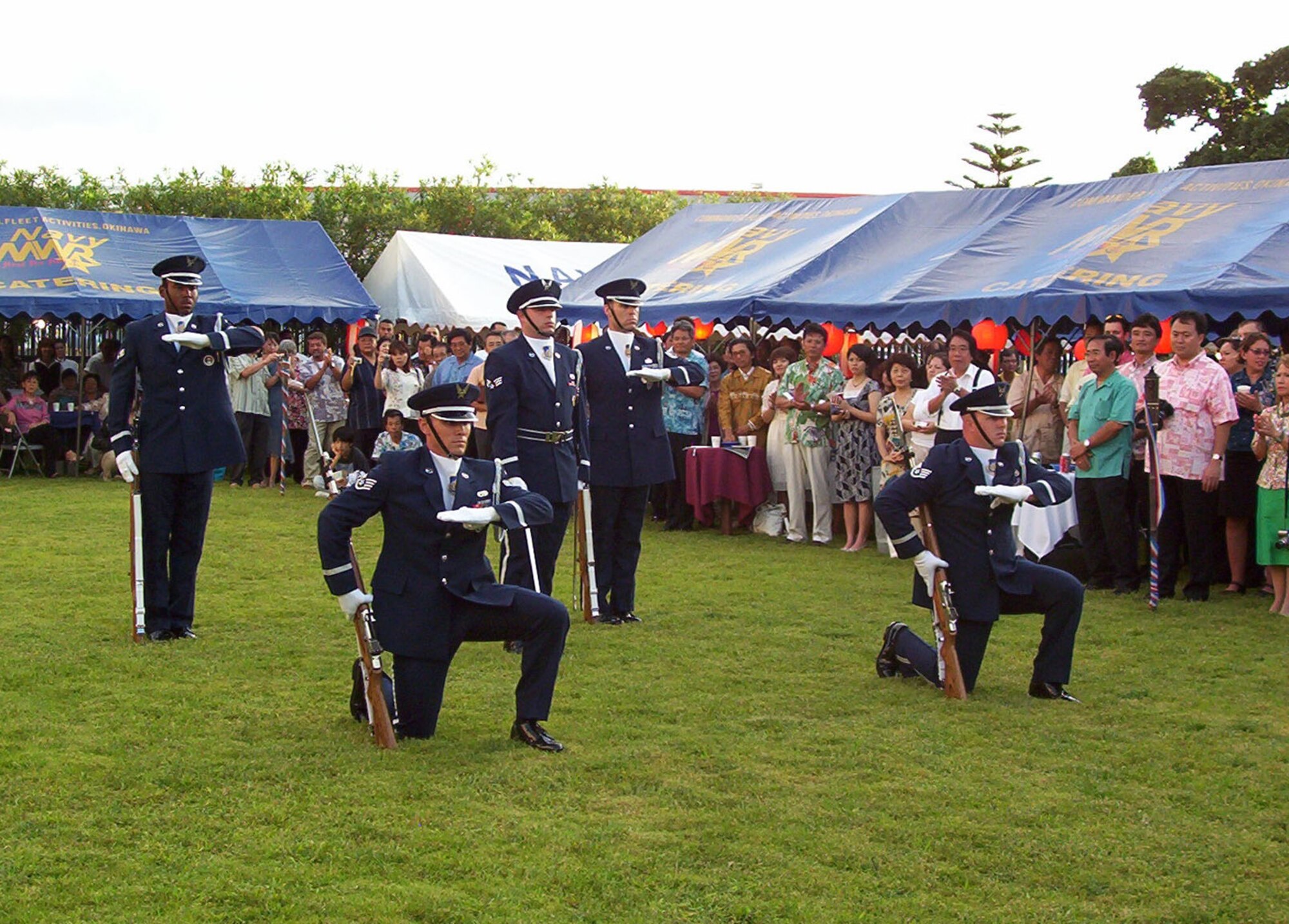 Kadena Air Base Honor Guard Drill Team end their performance at the 231st United States Independence Day Ceremony and Garden Party at the U.S. Consulate in Naha, Okinawa, Japan, July 4, 2007.  The day was celebrated by more than 200 Okinawans and Americans.  In addition to the drill team, the Marine Corps III MEF Band performance, an Hawaiian Ukulele and Hula dance and a Karate performance was also enjoyed by those in attendance.  (U.S. Air Force photo by Maj. Dani Johnson)