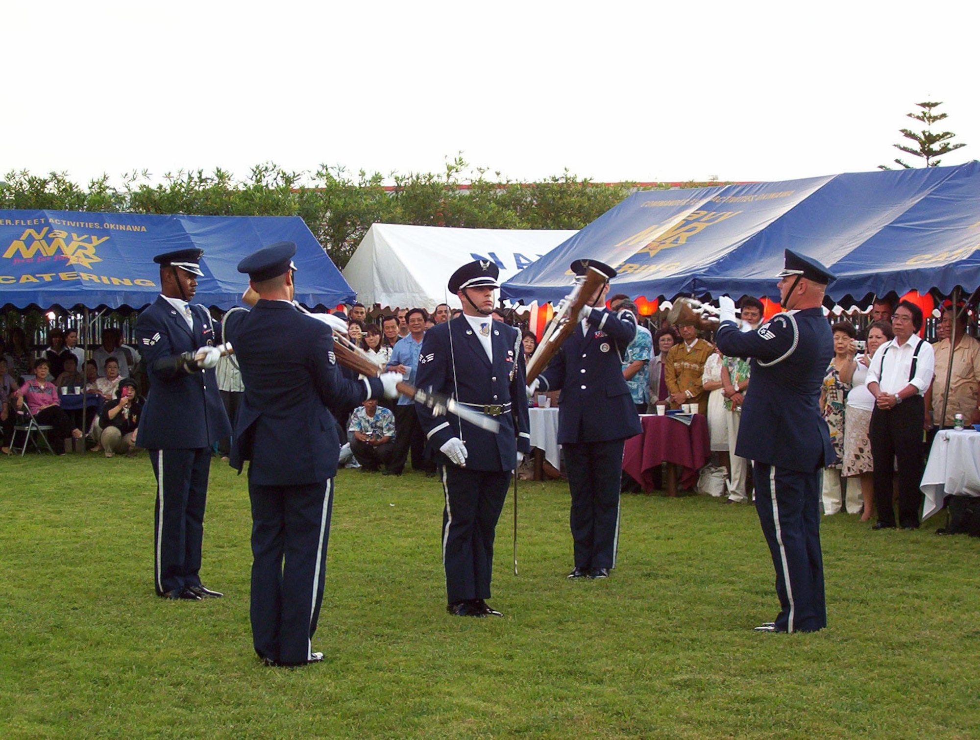 Kadena Air Base Honor Guard Drill Team performs at the 231st United States Independence Day Ceremony and Garden Party at the U.S. Consulate in Naha, Okinawa, Japan, July 4, 2007.  The day was celebrated by more than 200 Okinawans and Americans.  In addition to the drill team, the Marine Corps III MEF Band performance, an Hawaiian Ukulele and Hula dance and a Karate performance was also enjoyed by those in attendance.  (U.S. Air Force photo by Maj. Dani Johnson)