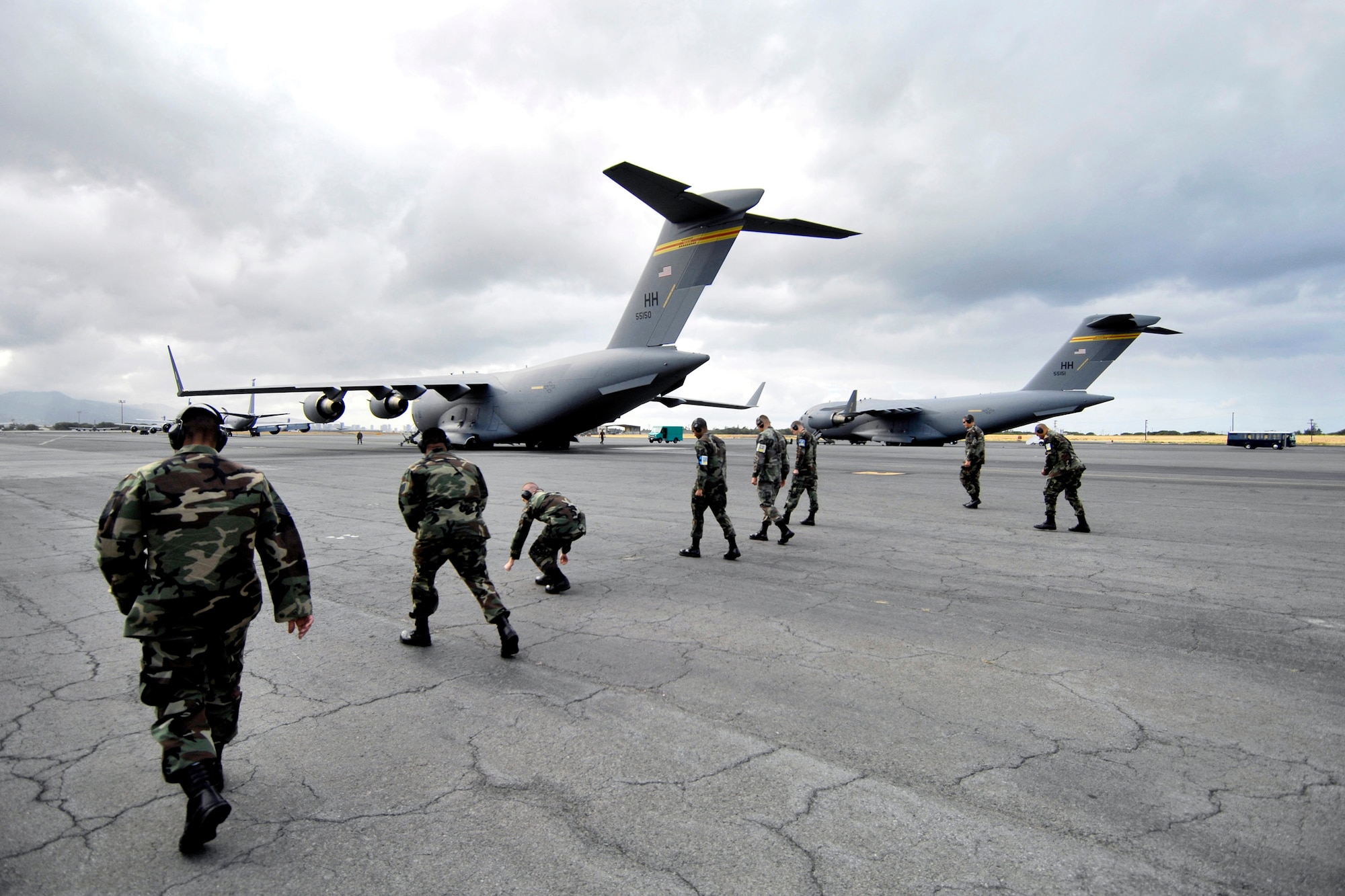Crew chiefs conduct a foreign object debris, or FOD, walk June 28 before launching a C-17 Globemaster III from Hickam Air Force Base, Hawaii. The Airmen, from the 15th Aircraft Maintenance Squadron, are practicing for the upcoming Air Mobility Command Rodeo at McChord AFB, Wash. (U.S. Air Force photo/Tech. Sgt. Shane A. Cuomo)
