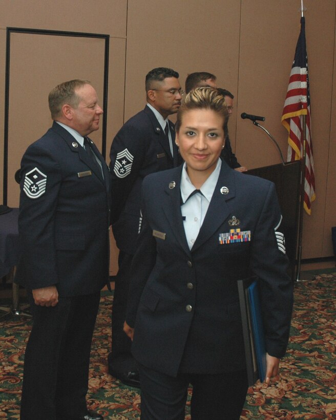 Air Force Reservist Master Sgt. Eulalia Valenzueala, 940th Logistics Readiness Squadron supply specialist, is all smiles after putting on her new stripes at the 940th Air Refueling WingWingWing Top Three Induction Ceremony June 10, 2007 at the Recce Point Club, Beale Air Force Base, Calif. Twenty-five new senior non-commissioned officers were inducted into the Top Three.  
(U.S. Air Force photo/MSgt. Ellen L. Hatfield)
