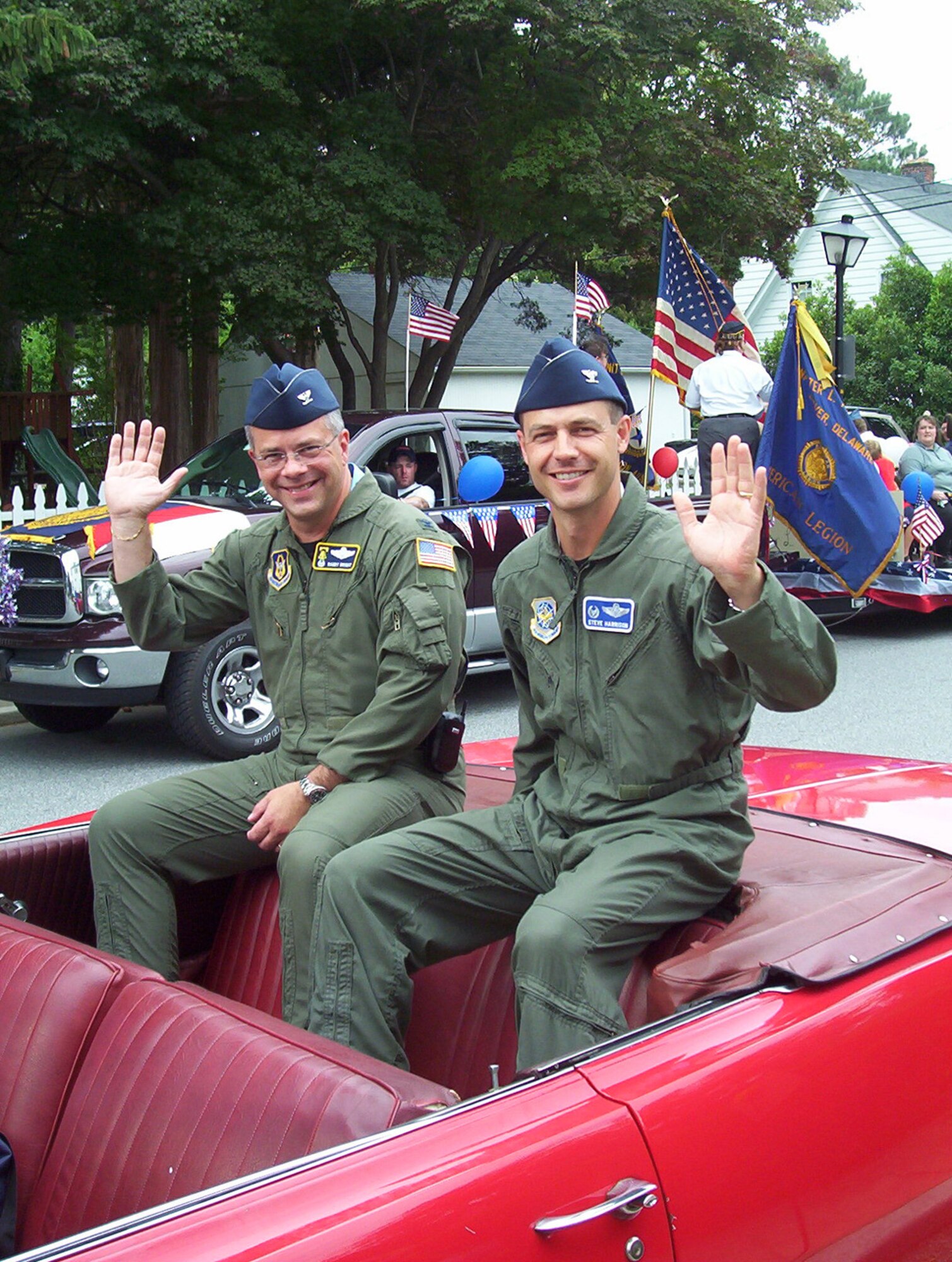 Col. Randal L. Bright (left), 512th Airlift Wing commander, and Col. Steven Harrison, 436th AW commander, served as co-grand marshalls of the Independence Day Parade in Dover July 4. The base was also represented with two formations of marching Airmen and security forces vehicles. The Team Dover entry won the title of Most Patriotic and a prize of $200. (U.S. Air Force photo/Sue Walls)