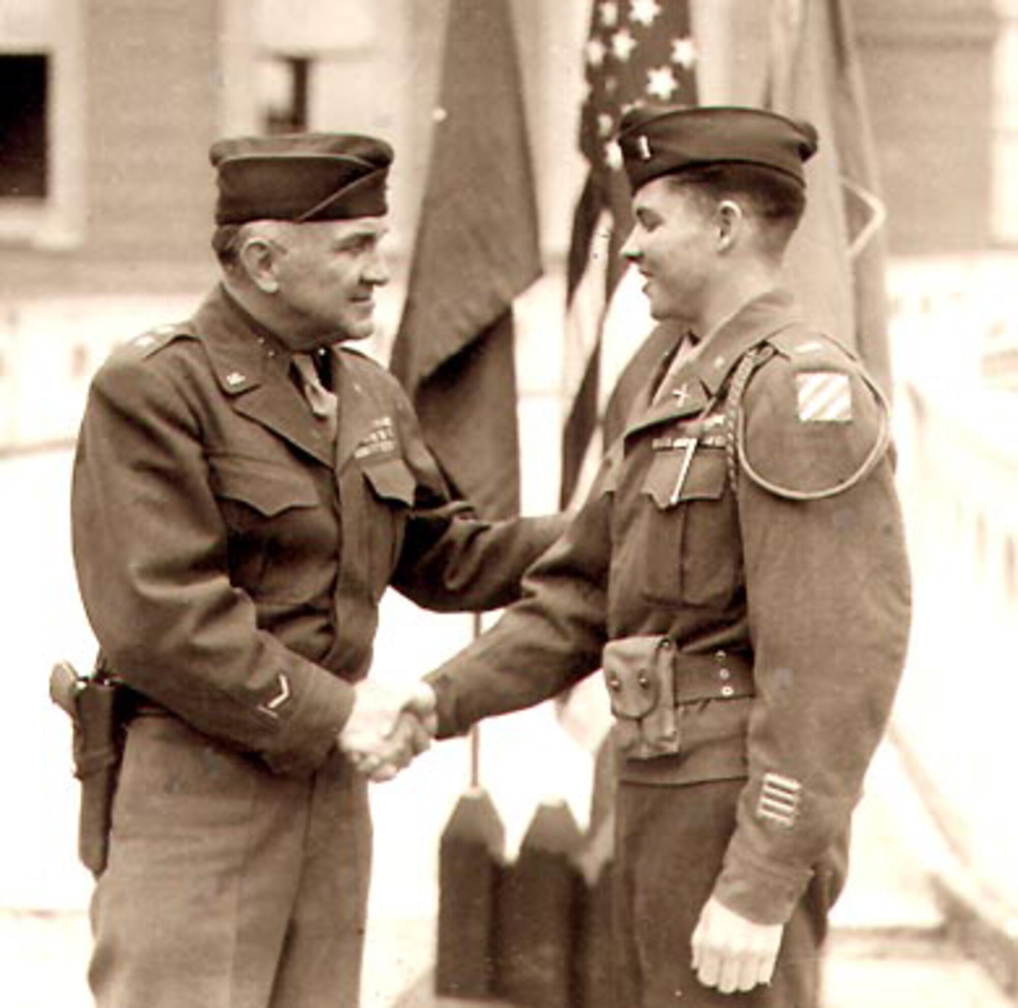 Retired Maj. Gen. 'Iron Mike' O'Daniel presents 1st Lt. Audie Murphy with a Distinguished Service Cross. (Courtesy photo)