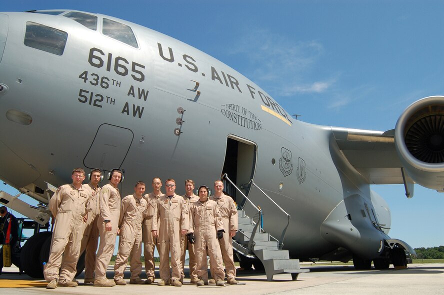 The Spirit of the Constitution’s crewmembers Capt. Douglas Palagi, Senior Airman Robert Paradis, Staff Sgt. Bryan Bennett, Staff Sgt. Jeff Weatherly,  Staff Sgt. Christopher Copans, Maj. Brian Oconnell, Maj. Justin Riddle, Senior Airman Todd Barney and Capt. Jeffrey Jones return from the first real-world mission flown by a Dover Air Force Base C-17 airframe. The crew just returned from a cargo-delivery mission into Afghanistan Monday. (U.S. Air Force photo/Tech. Sgt. Kevin Wallace)