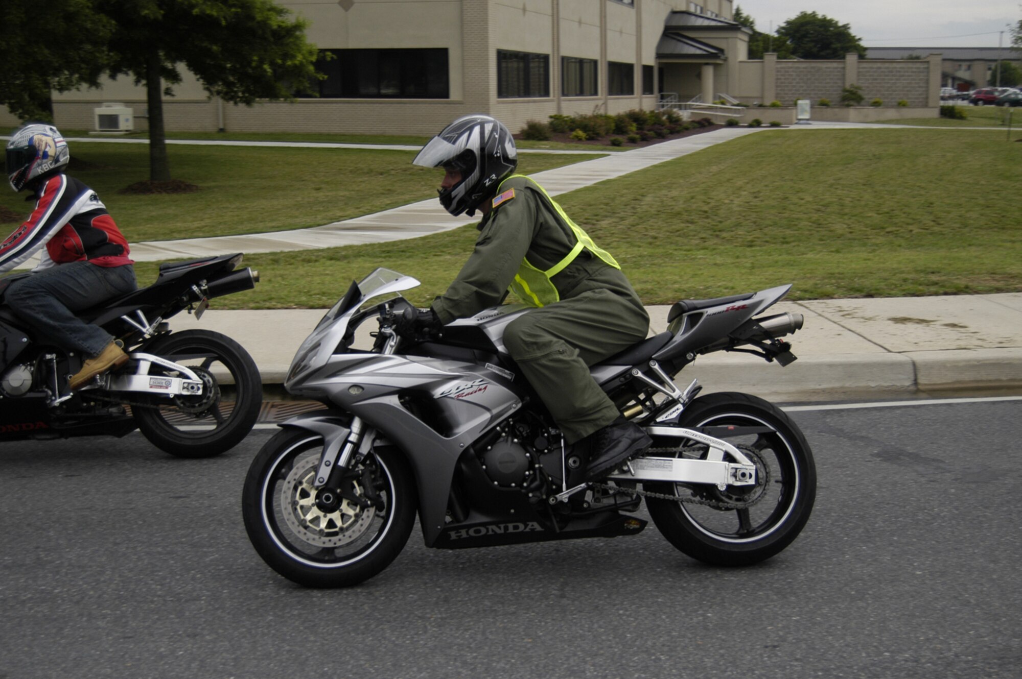 A Team Dover member heads off base after participating in the group ride down Runway 14 during Motorcycle Safety Day June 29. Members participated in several activities including a sport-bike safety briefing, bike show and group ride. (U.S. Air Force photo/Senior Airman James Bolinger)