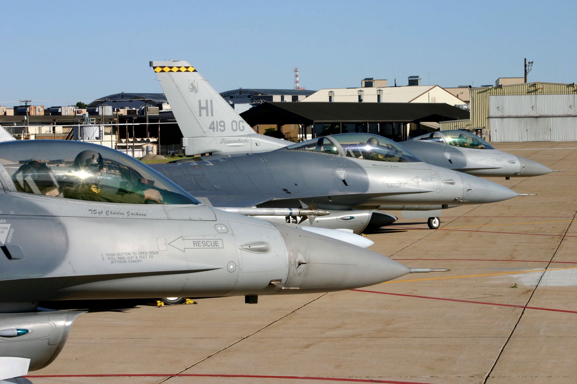 The last three F-16 Fighting Falcons assigned to the 419th Fighter Wing prepare to taxi for departure June 28 from Hill Air Force Base, Utah. The wing's entire fleet of F-16s have been reassigned to other Reserve and Air National Guard bases.  (U.S. Air Force photo/Tech. Sgt. Michael Owens)