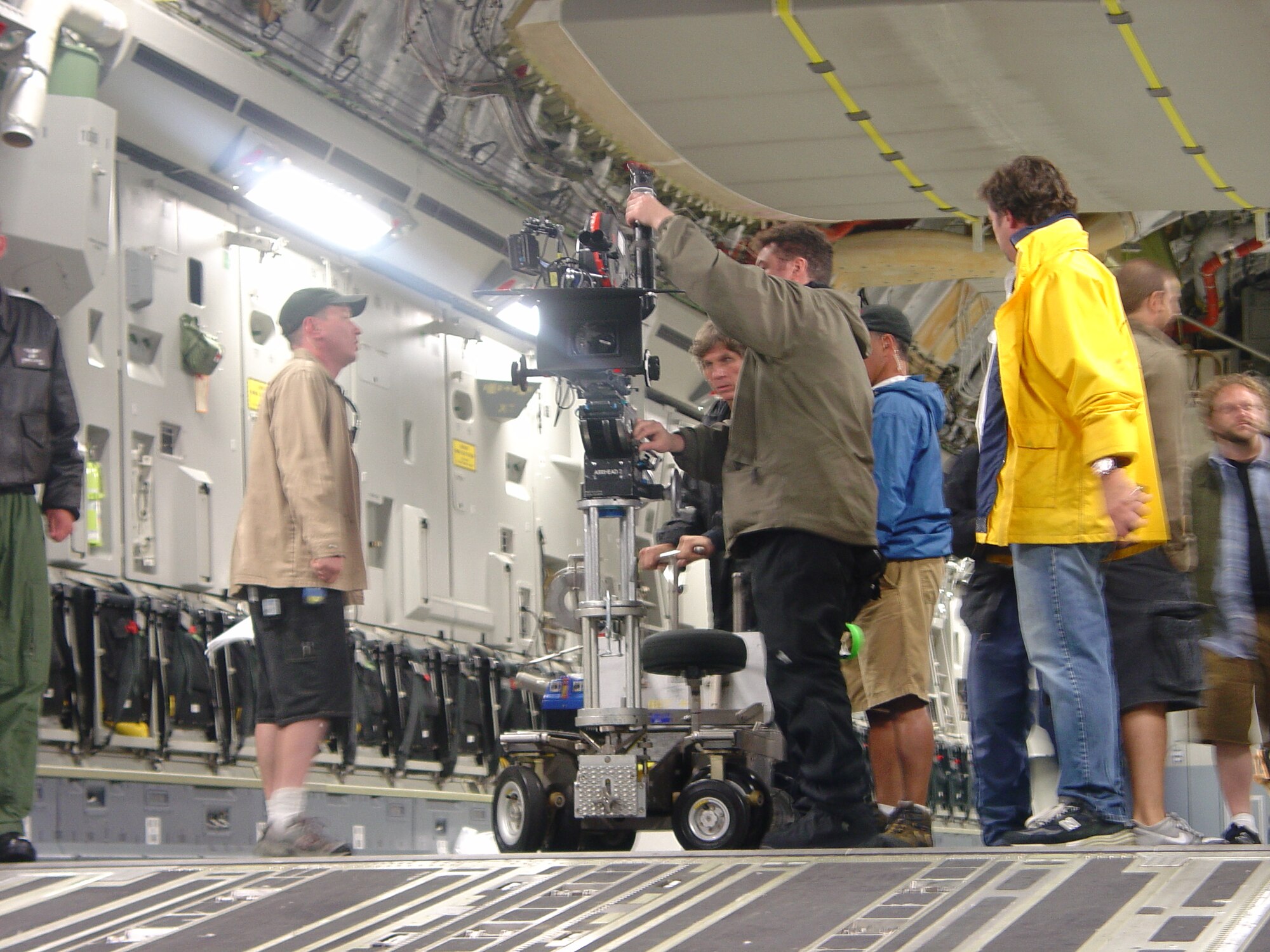 Inside a C-17 Globemaster III at McGuire Air Force Base, crew members from HBO Films shoot scenes for "Taking Chance".  The film portrays the experiences and encounters of Marine Lt. Col. Mike Strobl while accompanying Marine Pfc. Chance Phelps to his final destination.